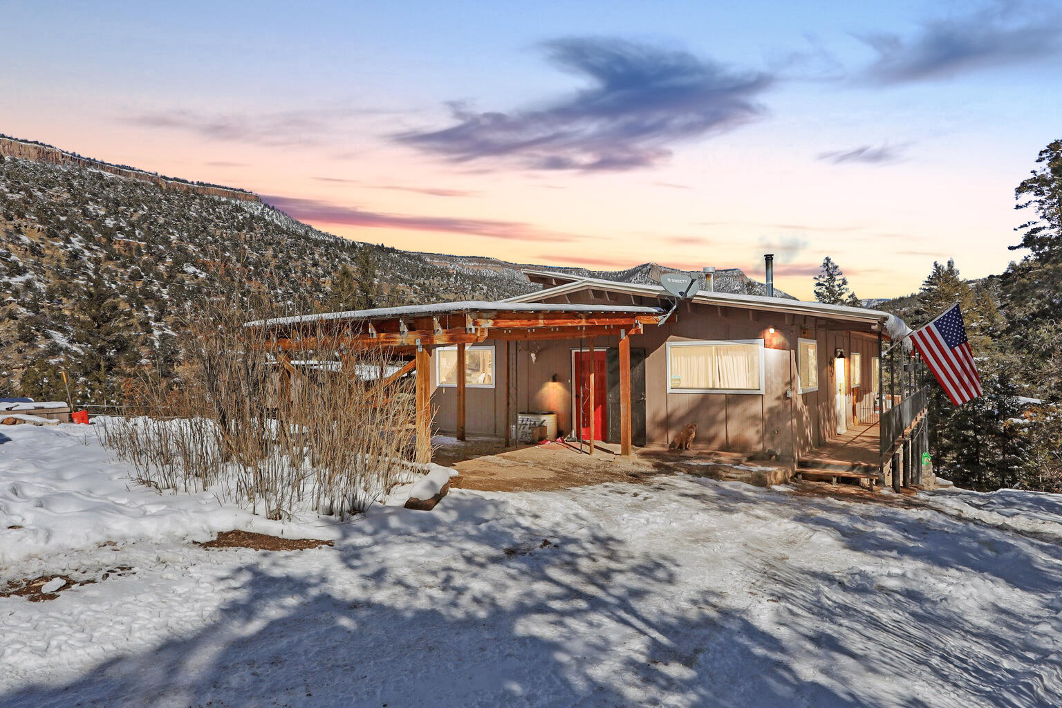 This private mountain getaway, has stunning views of the Jemez Valley that are waiting for you. Just imagine walking around the large deck that partially surrounds the home. This home features 5 bedrooms, 2 baths, a large kitchen, and it has plenty of storage throughout the 2,827 sq ft house. The loft above is an added bonus that could easily be a home office or play area. The home comes with an oversized basement that has an additional bedroom with additional space that can easily house an office, gym or studio. This hidden gem is quiet and peaceful and is loaded with plenty of extras around the property, including a chicken coop, 3 carports and a shed. And did I mention how close to the river it is and the views? This home comes with the adjacent lot 33. This is a must see!