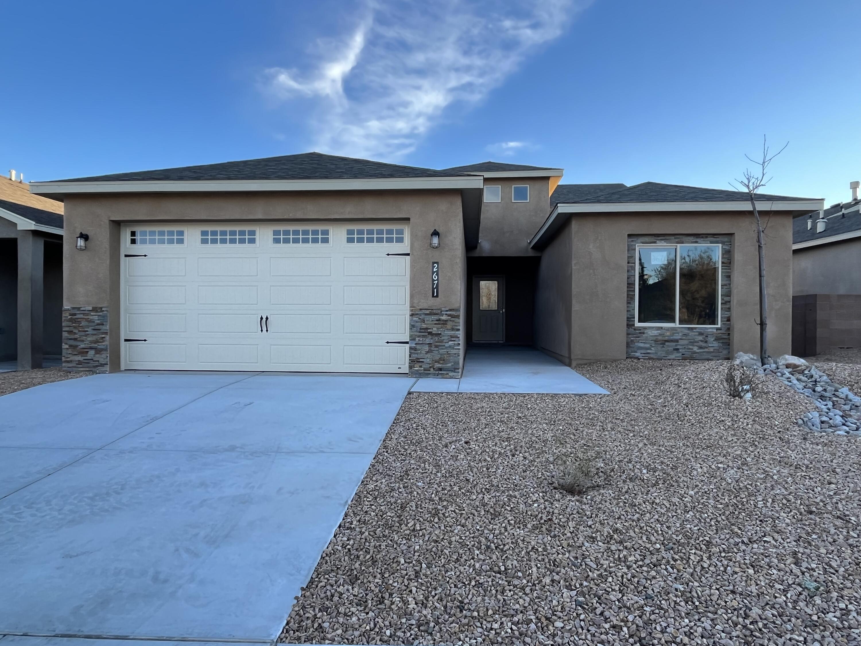 Stunning new construction home in one of the few Los Lunas gated communities! Take a look as you walk into the large entryway with overhead lighting and modern tile that flows into the large living room, centered with a gas fireplace and mantel. The kitchen not only has clean white cabinets and beautiful backsplash but plenty of space for a bar top, perfect for many uses. BONUS this home is built on an upgraded post tension slab. Schedule your showing today! -Pictures are of same floor plan but previous home built, colors are subject to change.
