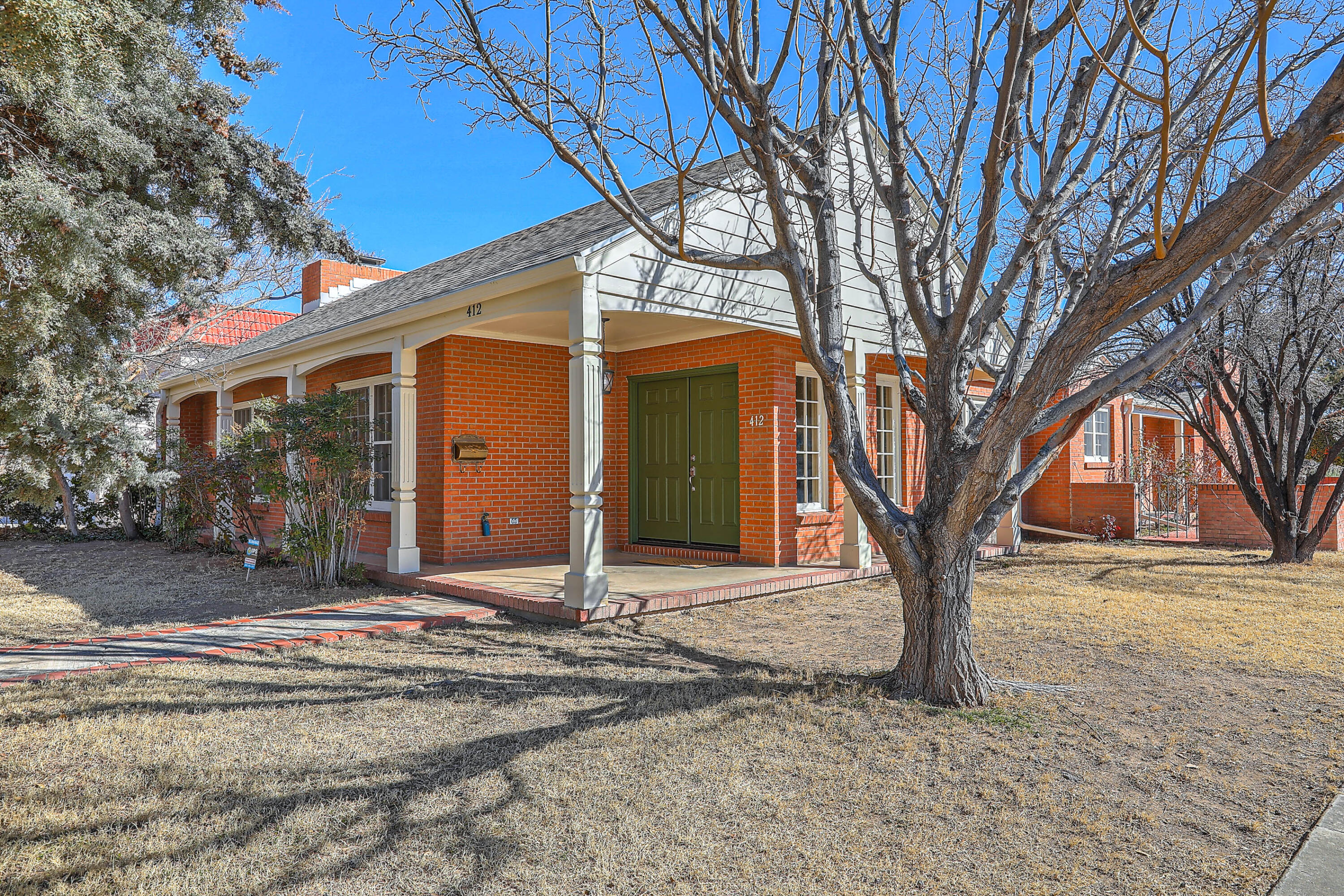 OPEN HOUSE SAT 12-3 & SUN 1 -4. Drive down a lovely tree-lined street in the heart of the Albuquerque Country Club neighborhood to 412 Laguna SW. This home was almost completely remodeled in 2022 - roof, plumbing, light fixtures, electrical, kitchen, bathrooms, flooring, garage door and more. Seller also added personal touches such as high end art gallery quality lighting, a wood door from a church in Spain and a gorgeous cast iron/porcelain bathtub from Portugal. There are even plans for a studio above the garage.