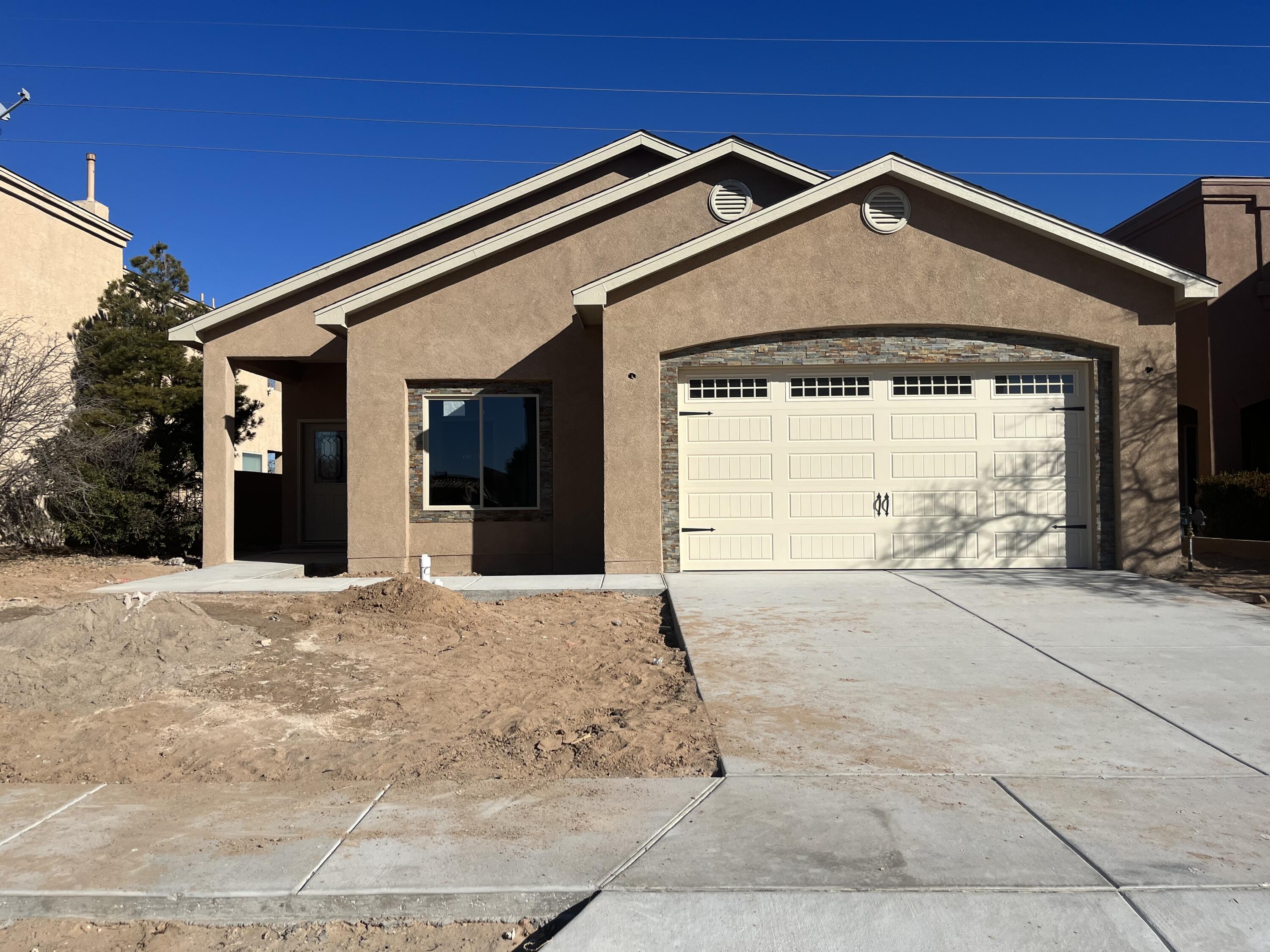 Come take a look at this newly constructed home which is located in the heart of New Mexico's fastest growing employment HUB's and one of the few gated communities in Los Lunas! This property has beautiful granite counter tops throughout, modern tile floors in all common areas, cozy gas fireplace and a walled in backyard just to mention a few of the great features. BONUS this home is also built on an upgraded post tension slab.