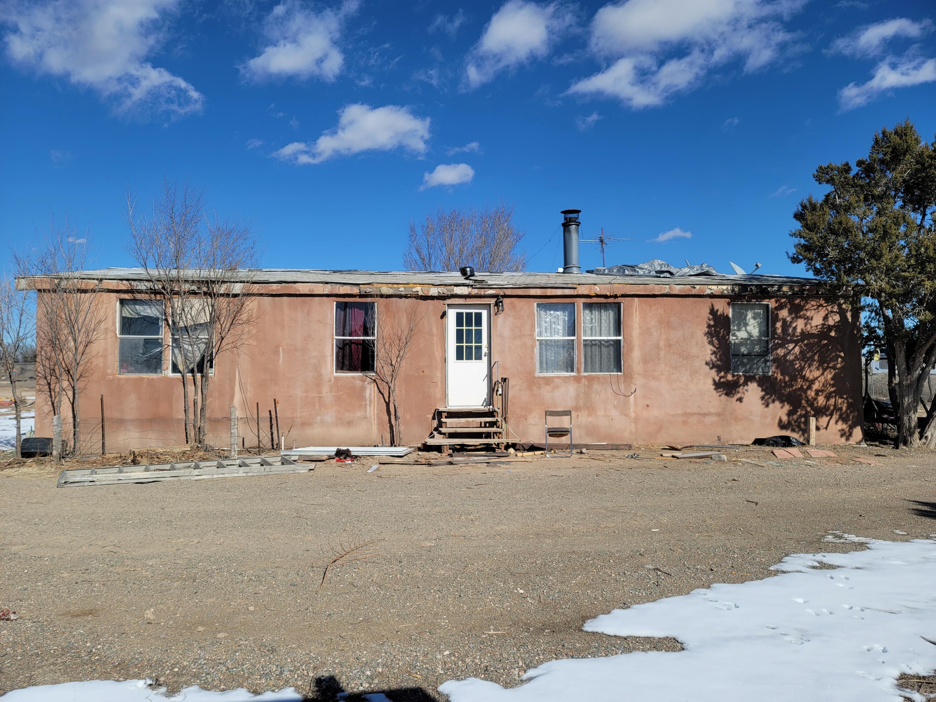 East mountain opportunity to fix up on 1 acre fully fenced.  3 bedrooms, bathrooms home has stucco. Property being sold in as is condition. Cash or renovation loan possible. Contact your favorite REALTOR to view this property and start investing in your future