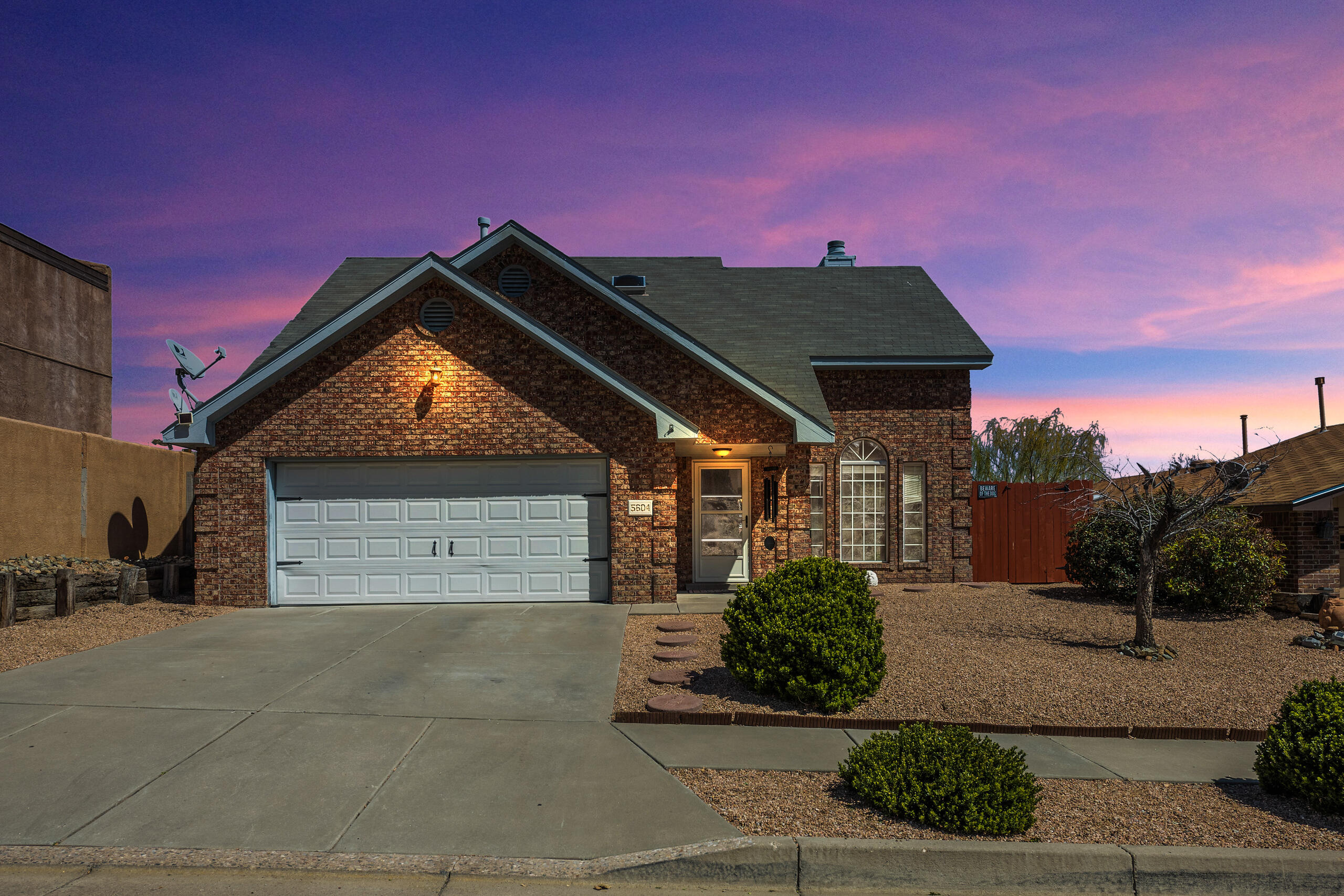 Stunning Opel Jenkins Brick Home in Santa Fe Village that sits directly across from the Petroglyphs Open Space!  Very functional floor plan with the primary bedroom downstairs featuring an open concept with the living room, dinning room and kitchen in the same area.  Upstairs features two spacious bedrooms that share a jack and Jill bathroom and a loft that can be used as an office or a playroom.  This home has been very loved and it shows, very well maintained featuring new windows and bathrooms recently renovated.  Don't forget about the perfect backyard to enjoy the coming summer nights.  Call your favorite realtor and schedule your showing today!