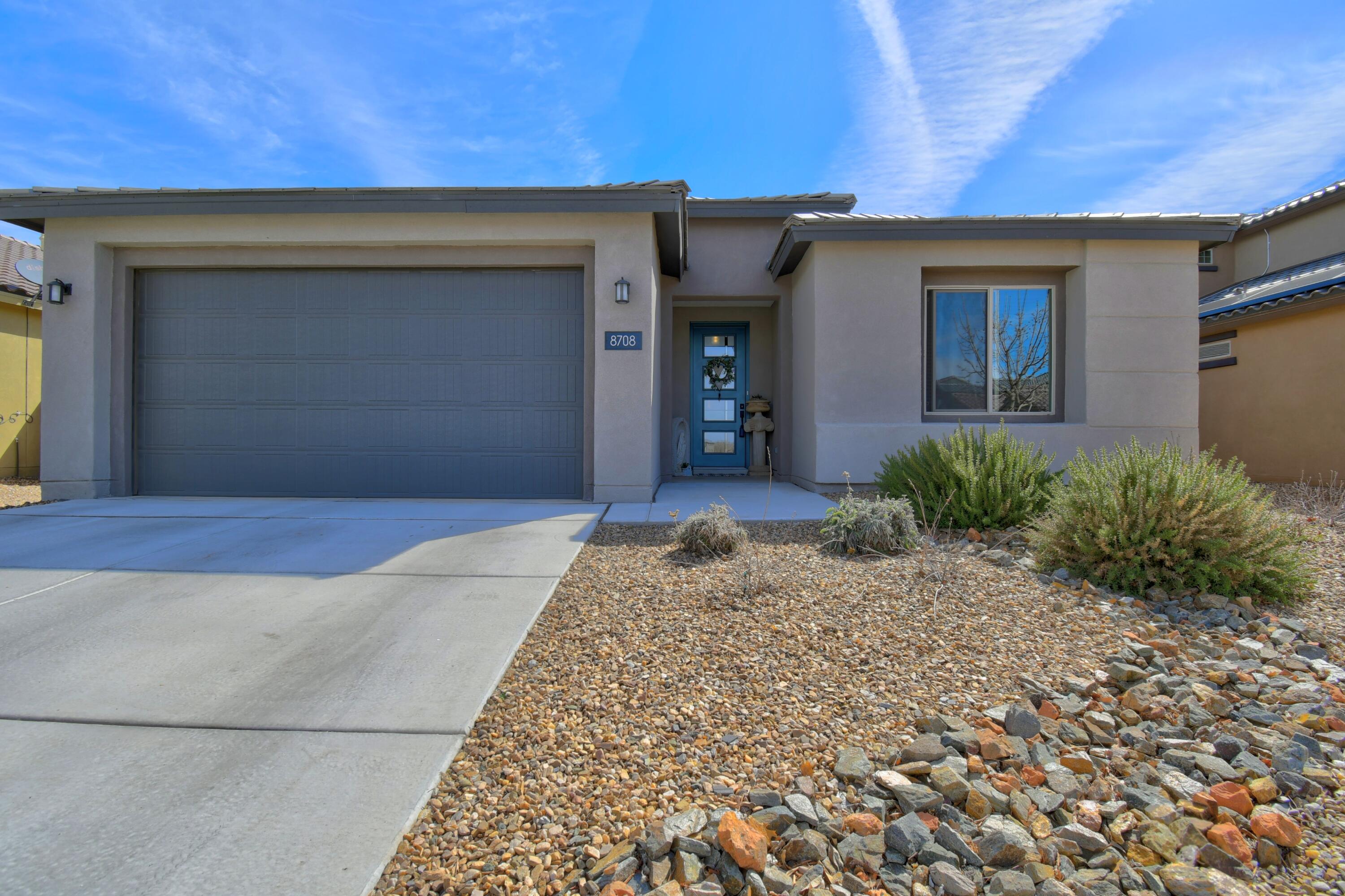 This home boasts over $28,000.00 in upgrades, including a Whirlpool gas cooktop, Spring Valley Maple cabinet upgrade, custom cabinet crown molding, and a Yukon Blanco kitchen island with a quartz waterfall edge. The Oyster Gray tile backsplash complements the Moen pre-rinse spring pulldown kitchen faucet, while the PBA cultured marble vanities and Moen bath faucet package add a touch of luxury to the bathrooms. The secondary bathtub includes cultured marble walls, and the PBA walk-in shower features decorative stone accents, 3 clearstory windows, a bench seat, and 3 shower heads. The home also includes French doors in the flex room, an accent ceiling, a fully landscaped backyard and front yard with palms on a bubble drip, a tankless water heater, and a tile roof.