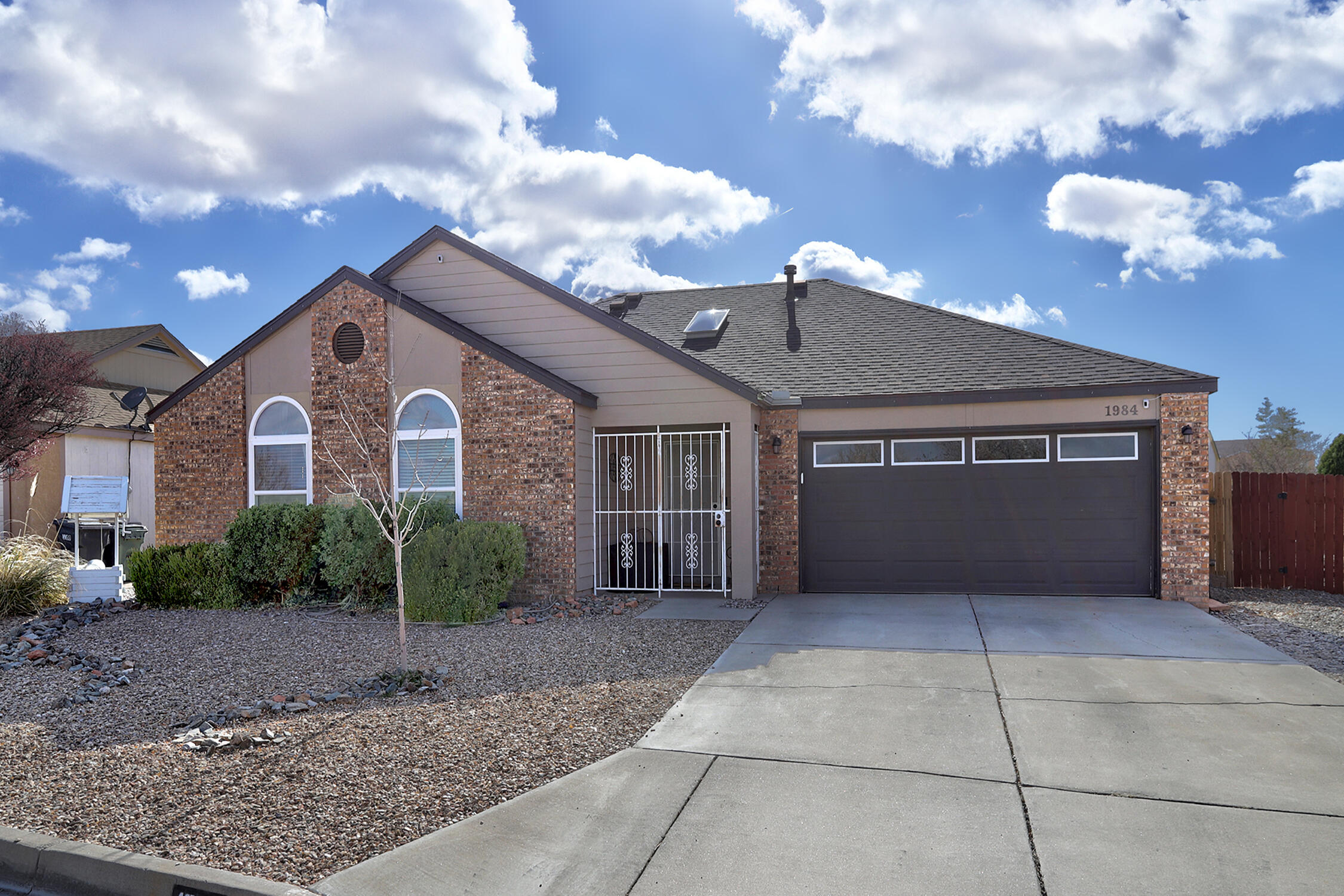 Hard to find 1,836 sq. ft. 4 Bedroom home with 2 full Baths on huge corner cul de sac lot. So many updates and improvements, including Kitchen remodel (2018), dishwasher (2021), Bathrooms remodeled (2019 and 2023), wood-look HDPC laminate flooring (2019), 10 new windows and slider to backyard (2019), complete tear-off roof/underlayment (2017), refrigerated air and furnace (2017), fireplace with vent blower (2020), exterior paint and gutters (2017), front and backyard landscaping with pergola (2020) just to name a few. Two spacious living areas open to kitchen.  Slider out to private, huge, fenced backyard with pergola. Truly move-in ready! 2 car attached garage (new garage door 2018) with keypad entry. Convenient access to Unser so close to shopping, restaurants, schools. Welcome Home!