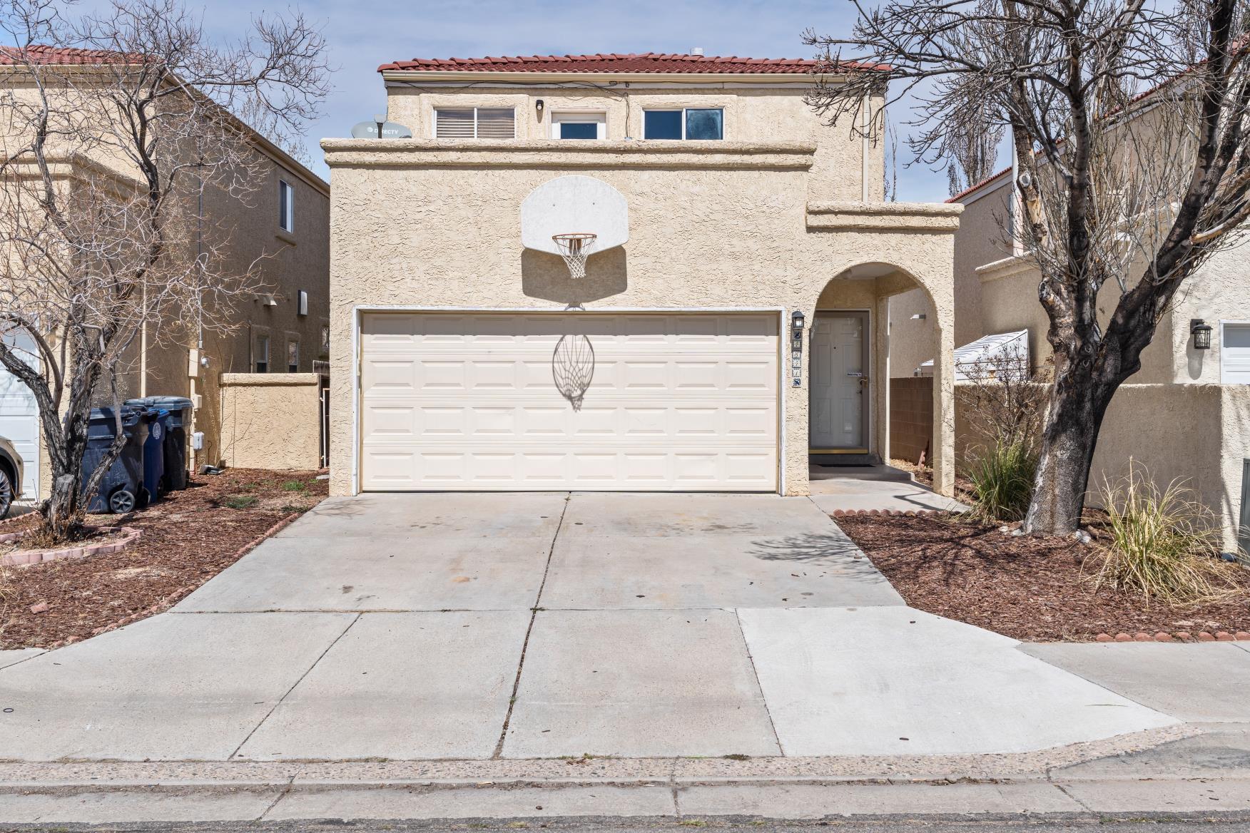 This beautiful two story home, in the desirable Northwest Heights, is ready for it's new owners! This location is minutes away from Montano and Paseo Del Norte and blocks away from the beautiful Mariposa Basin Park. No HOA or PID here. Enjoy a large primary bedroom with walk in closet and a walk-in shower with a separate jetted tub. Featuring two additional bedrooms and bathrooms with plenty of room for everyone. The open living/dining room is a great place for entertaining guests. All appliances convey. Schedule a private showing today! This one won't last.