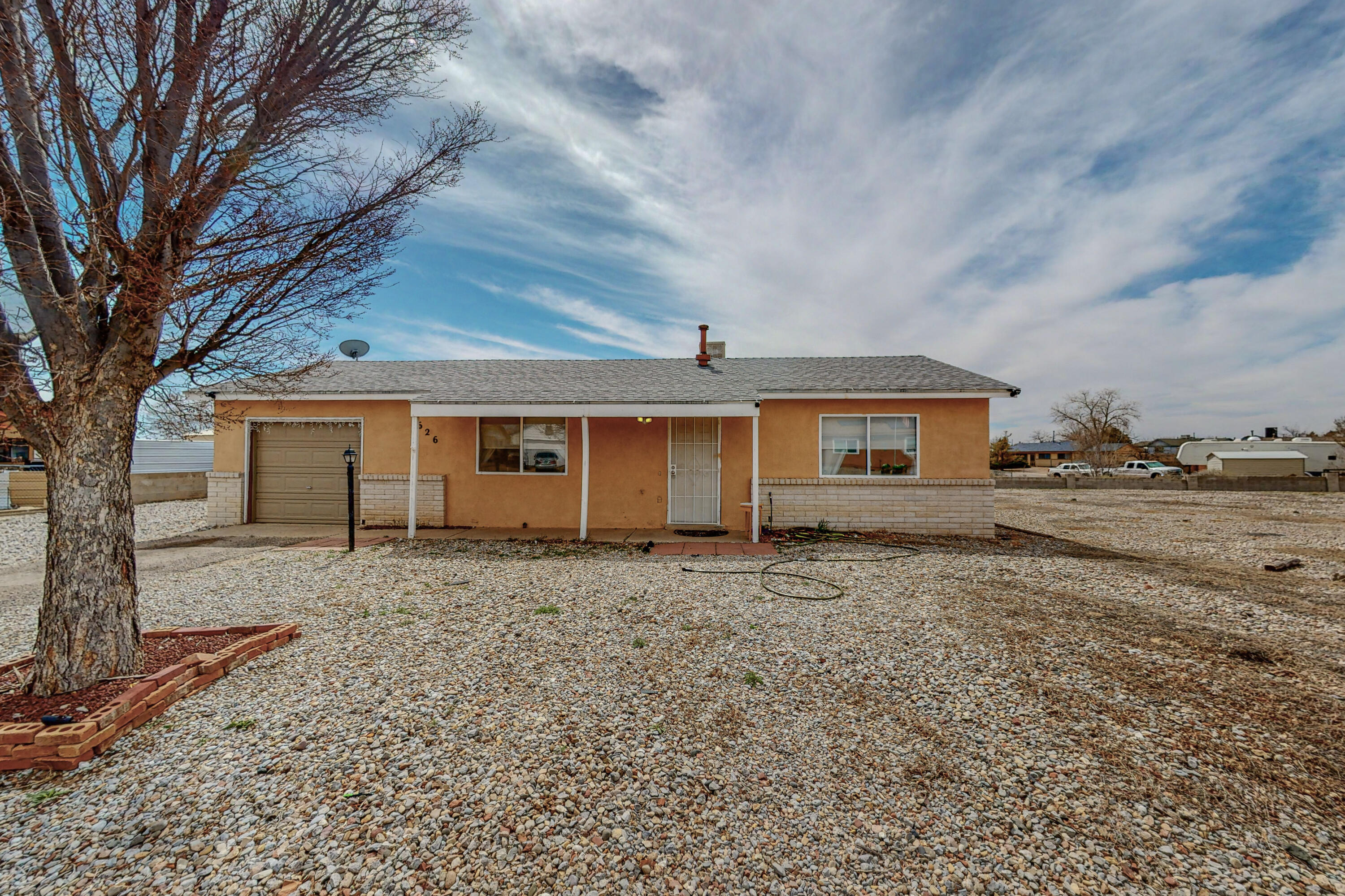 Come and see this 2 bedroom home nestled at the end of a cul-de-sac in Rio Rancho.  This beautiful home boast 2 bedrooms with laminate and tile throughout the entire home.  This home is conveniently located close to lots of amenities to include a movie theater, grocery stores and lots and lots of dining choices. A new roof to be installed (just waiting on the contractor).  The oversized lot has lots of potential with back yard access.