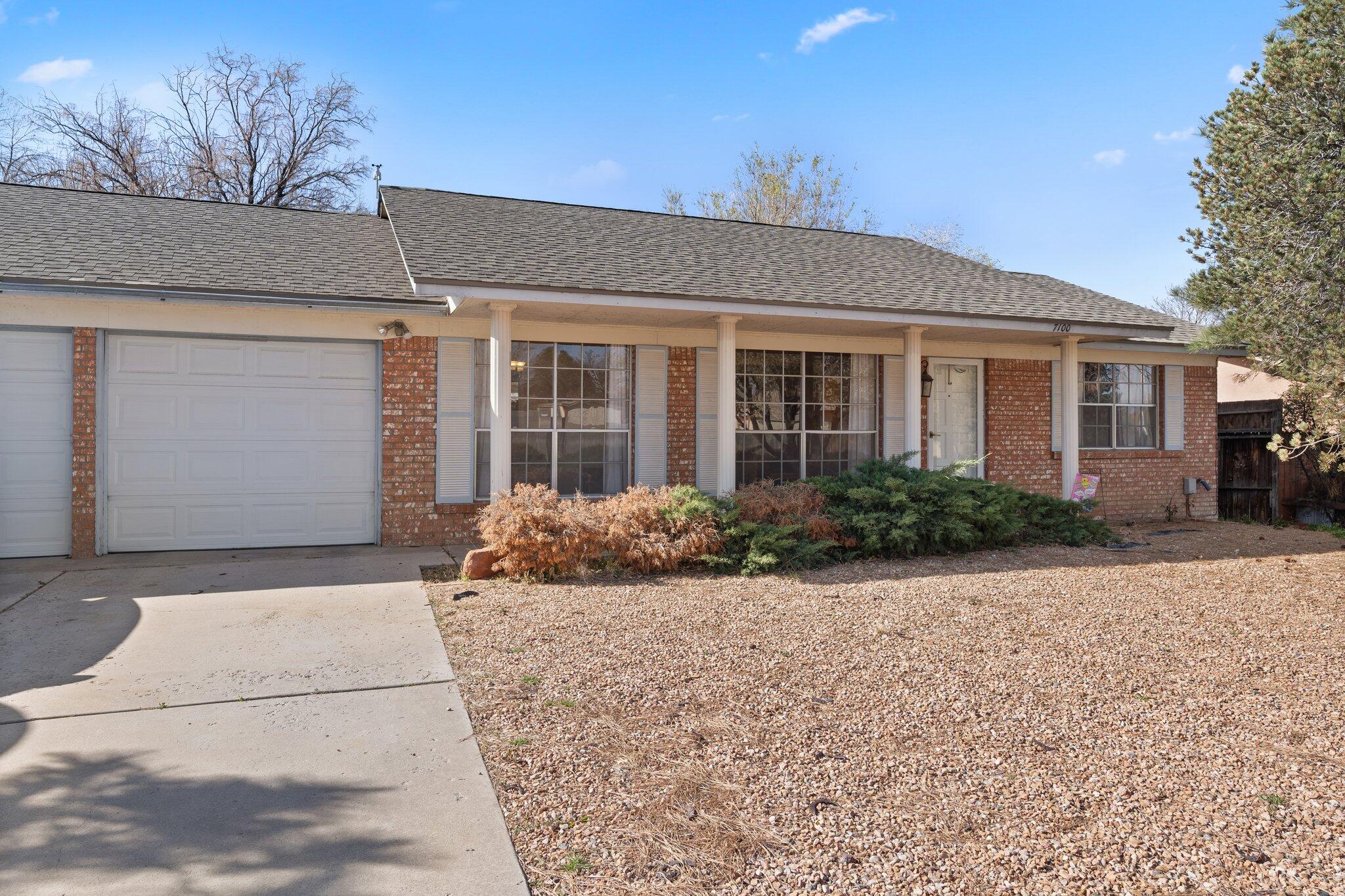 This 3BR/2BA home offers 1,624 SqFt of living space. This location has it all!  Minutes away from local parks, shopping, dining, bike trails, and more! This cherished home boasts a 2-car garage, large bay windows, recessed lighting, a wood burning fireplace, ceiling fans, carpet, tile, and vinyl flooring.  Spend some quality time cooking in your kitchen with all SS appliances, white cabinetry, custom tile backsplash, and granite countertops. Bask in the comfort of your covered patio, enjoying the sunny days and cool New Mexico nights. Welcome home!