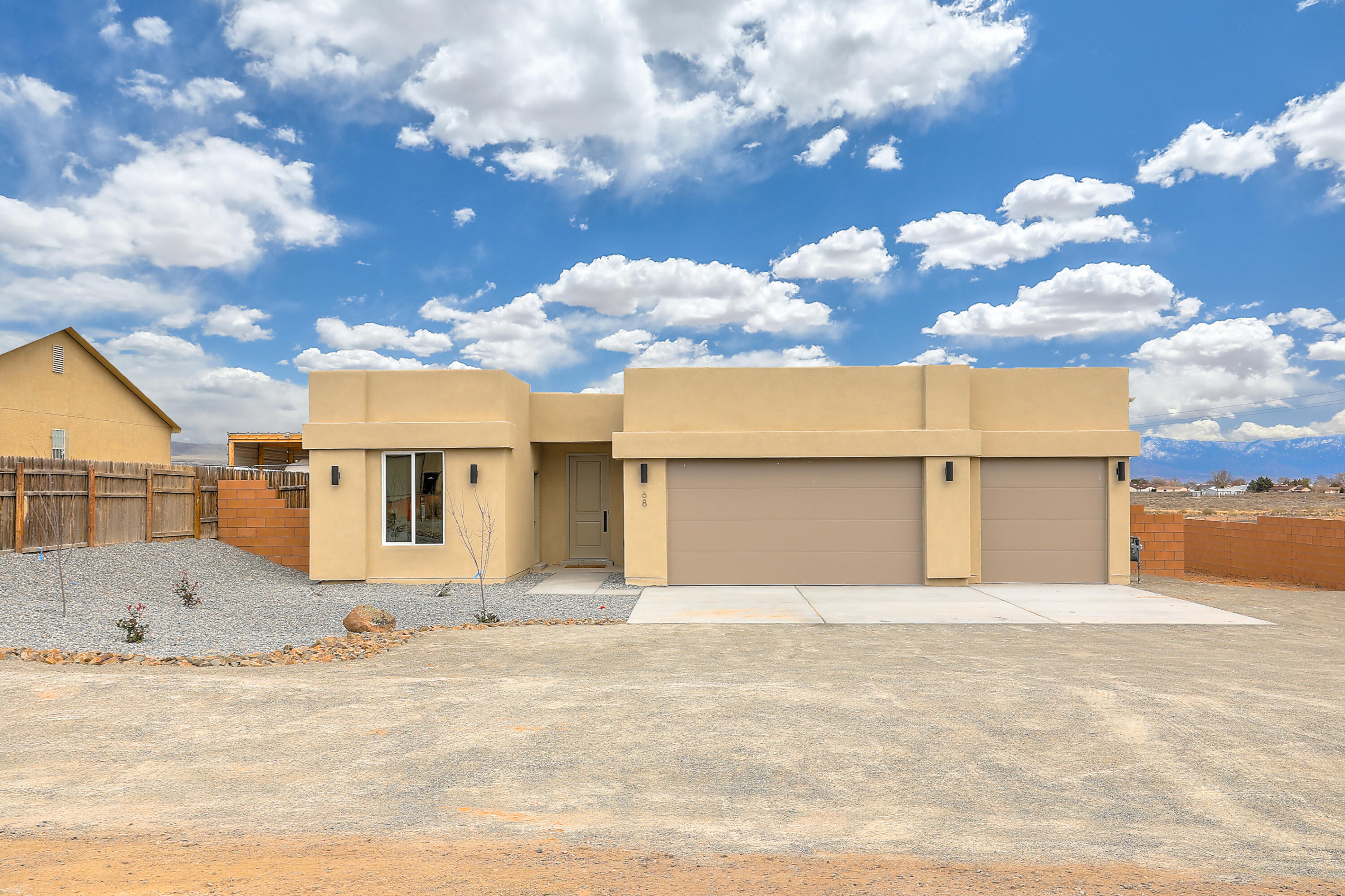 New Home in Rio Rancho with Views built by Fellowship Homes! Multi-generation floor plan with 4 bedrooms, 3 full bathrooms and a 3 car garage on 1/2 acre lot! Fully Functional Flex-suite which includes full bathroom, separate entrance, and kitchenette perfect for home business or kid in college! Modern feel with 9 foot ceilings, wood look tile flooring and flexible layout. Open great room invites easy entertaining including a separate Dining Room. Gourmet kitchen with granite counter tops, washed grey & blue shaker cabinets, breakfast bar and spacious pantry. Beautiful master suite with its own en-suite bath with free standing tub and shower and large walk in closet. Plenty of luxury features: refrigerated air, blown-in insulation, low-e windows and more!