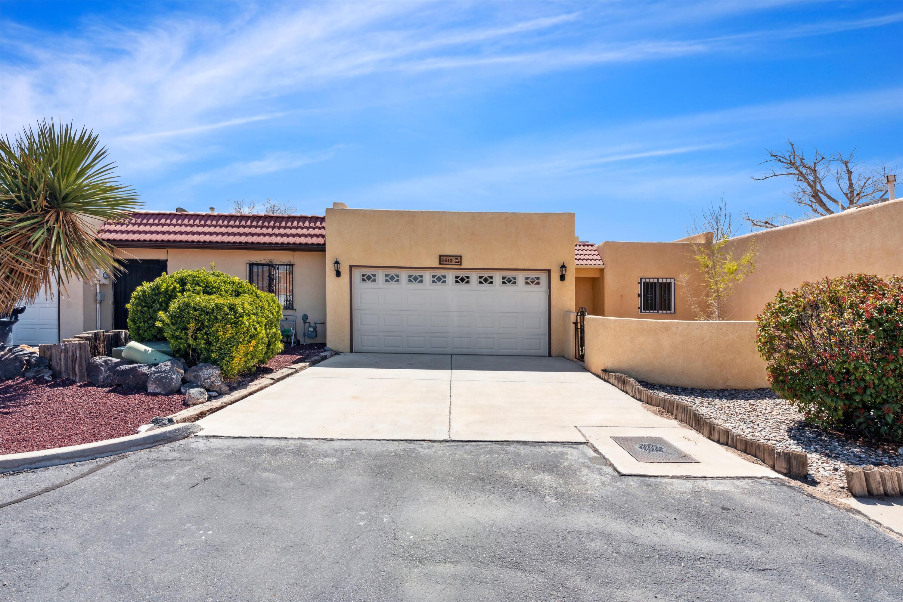Great townhome located near shopping and I40!  Backs up to a private section of Ladera Golf Course, with views of the mountains. Remodeled home featuring Laminate wood floors throughout, new bathroom vanities, and Granite countertops in the kitchen.  This wide open floor plan is perfect for you!  This clean home will not last long!