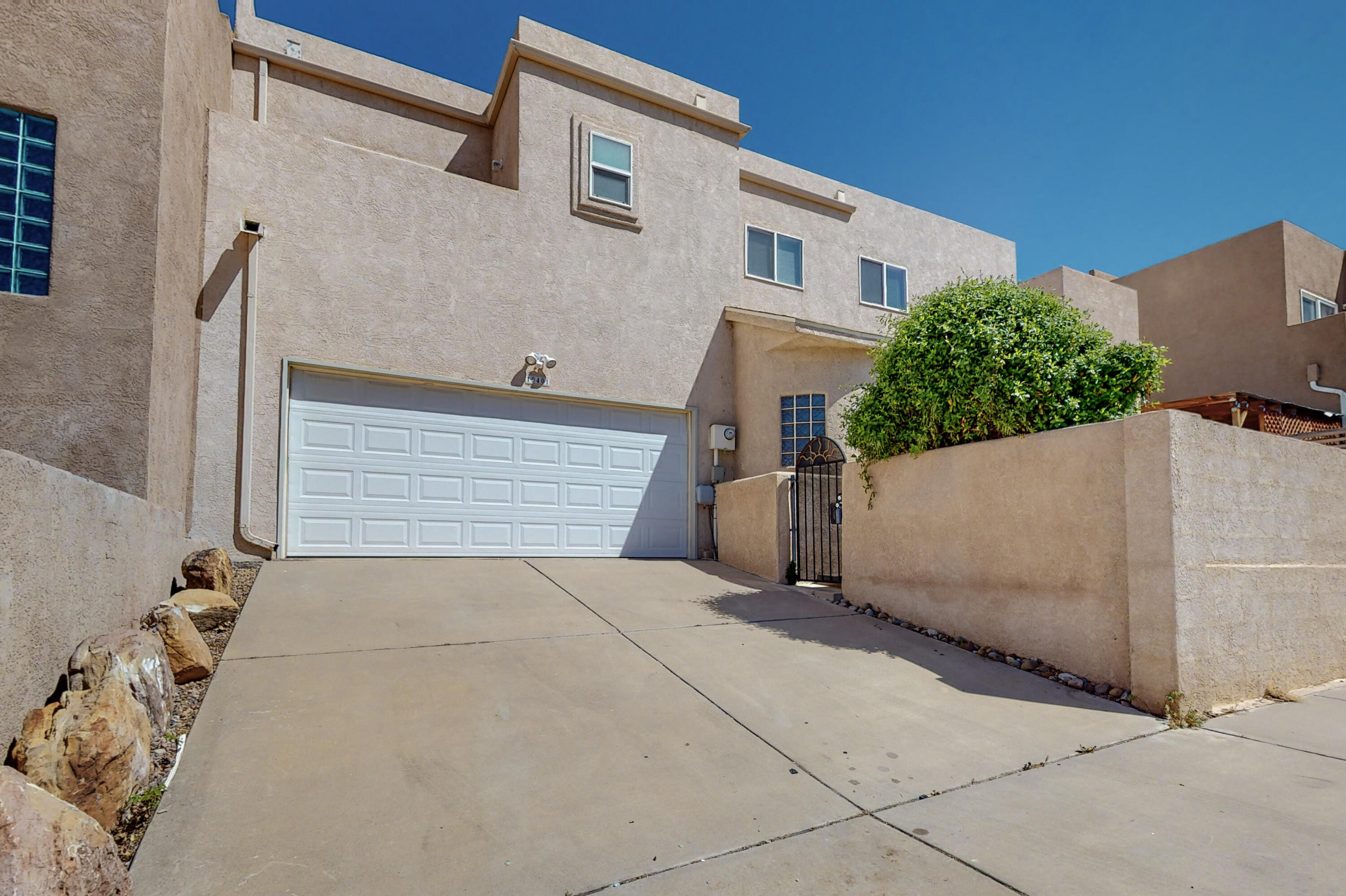 WOW!  Location, Location, Location!  This home is close to everything. In the heart of the NE Heights of Albuquerque and in sought after Eldorado HS District, this 2 bedroom, 2 bath beauty is ready for a new owner. Beautiful kitchen with granite counters and ample cabinet space boasts a lovely view from the picture window. The great room is spacious and flows right into the eat in kitchen area. Out the back door, you will be delighted to find a charming patio area that is low maintenance with southwest landscaping and has plenty of space for entertaining or simply enjoying the cool NM mornings with a cup of coffee. There is also a good sized greenhouse out back as well. Upstairs you will find the 2 bedrooms and 2 full bath and each with it's own private deck to take in the gorgeous view.