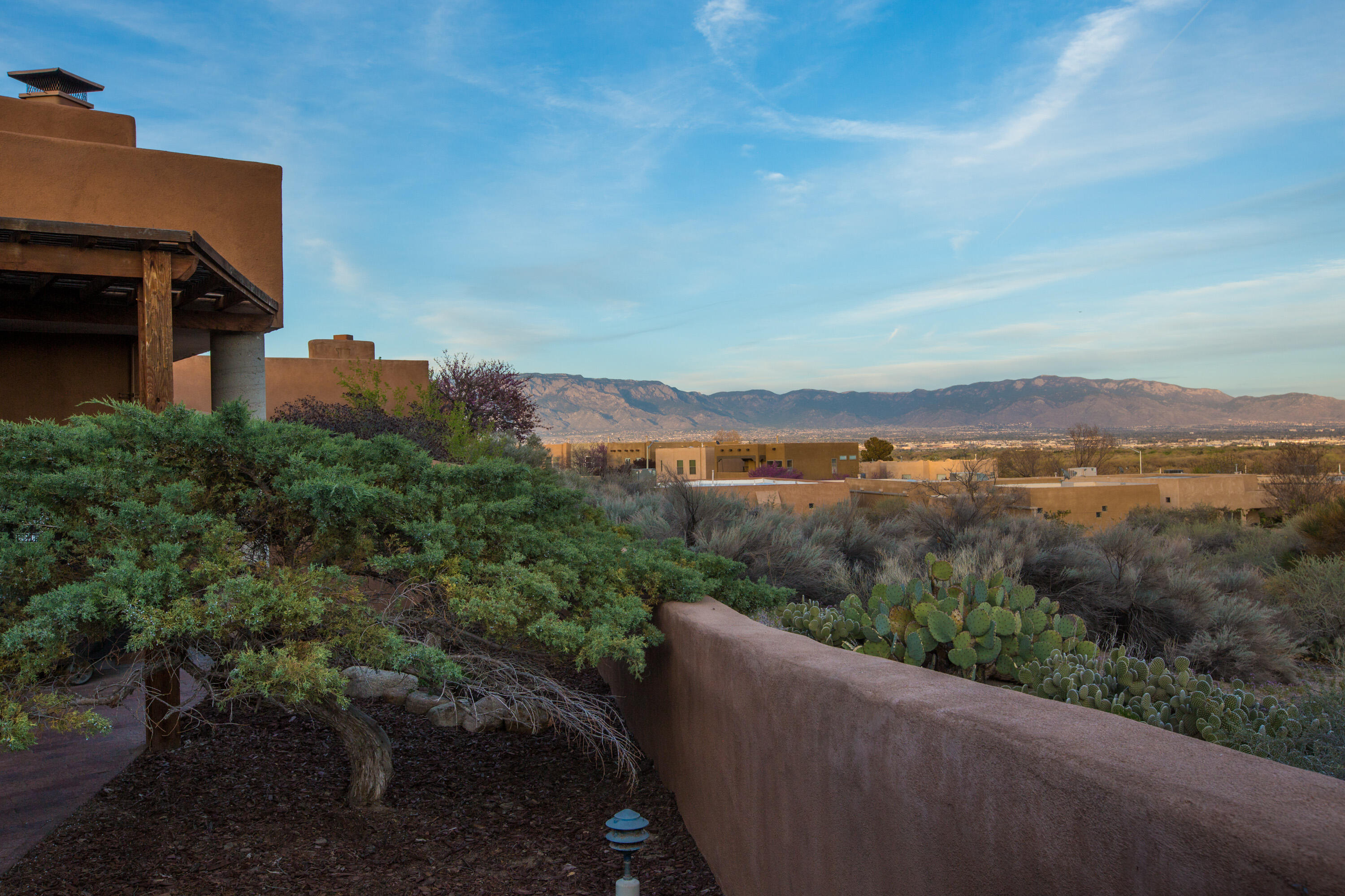 A fantastic opportunity to live in one of the coveted La Luz Del Oeste Townhouses! Open and bright with stunning, panoramic views from every room that are undeniably wonderful! Every room is soaked in warm natural light. Stylish contemporary southwestern finishes are elegant and understated. Tasteful updates throughout make for effortless use and enjoyment. Updated flooring, tongue and groove ceilings and heavy wood beams add to the charm! The office has built-in bookshelves and could easily be a 3rd bedroom. There are 2 very private courtyards, one in front, one in the back. The HVAC is less than a year old. This is one of the best west side locations only a very short distance to every conceivable service and amenity, transportation, the river & the east side! Thanks for looking!