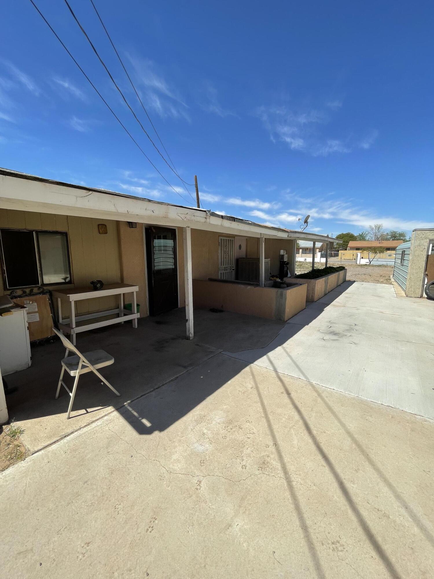 Great investment property in the south valley.  Needs TLC but definitely has great potential.  Property had a mobile home on it at one point as well(buyers need to inquire with Bernalillo County Zoning if a MH is still permitted. Backyard access possible to an alleyway.