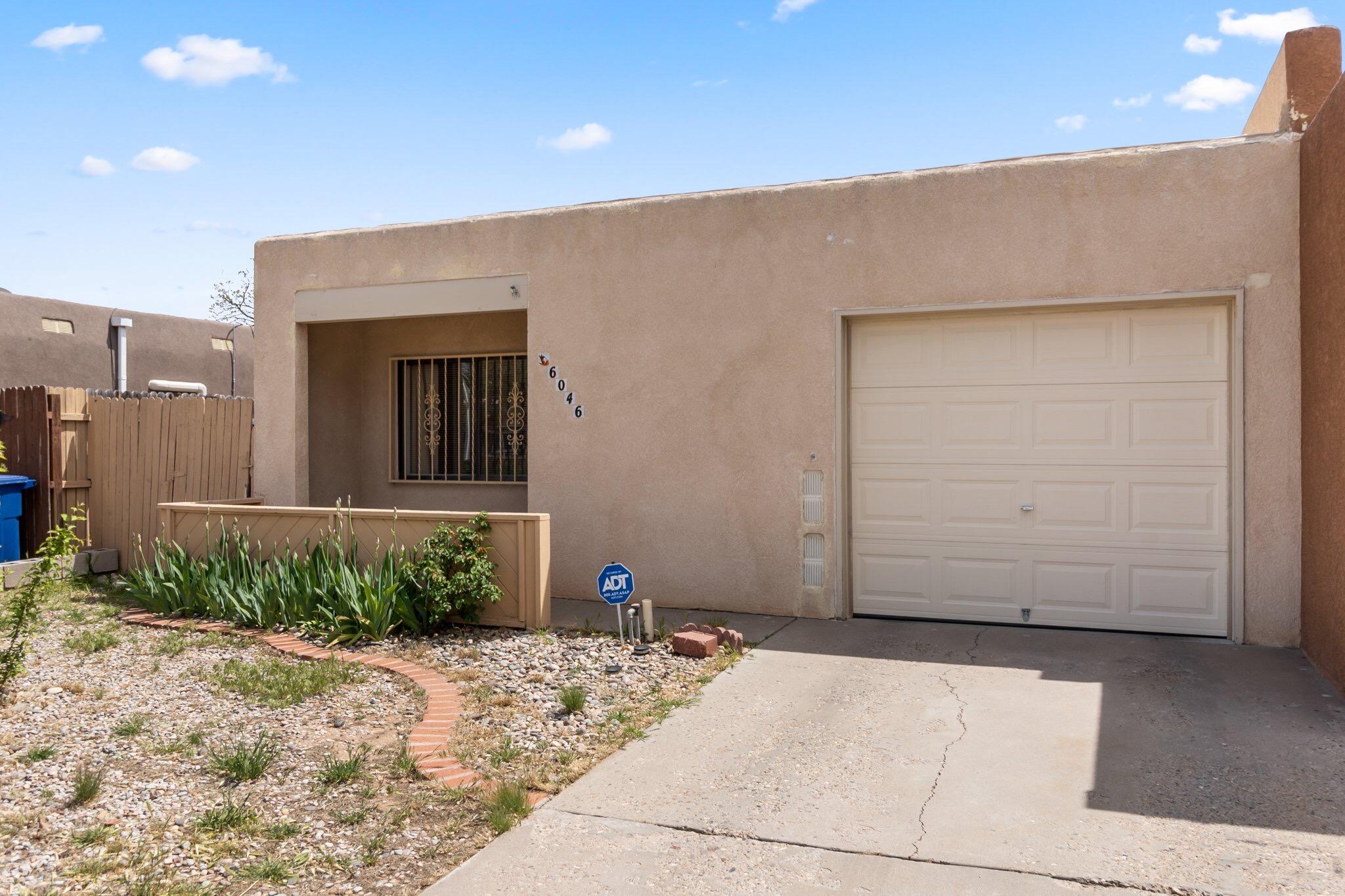 SOLD BEFORE ACTIVE. This 2 bed/2 bath/1 car garage charmer comes with a cozy front porch sitting area for warm summer ABQ evenings. Inside, you'll find carpeted living areas and easy-to-clean flooring in the kitchen. Bedrooms are just the right size with storage capacity in the closets. Cook with ease and comfort in the U-shaped kitchen with ample counter seating, a convenient pantry, and classic, homey cabinetry. Private backyard is all fenced-in for those who love spending quiet time outdoors. Wrought iron secure windows provide added peace of mind. You will be just minutes away from golfing, gyms, and plenty of foodie-approved restaurants. With its unbeatable combination of comfort, you'll want to call today!