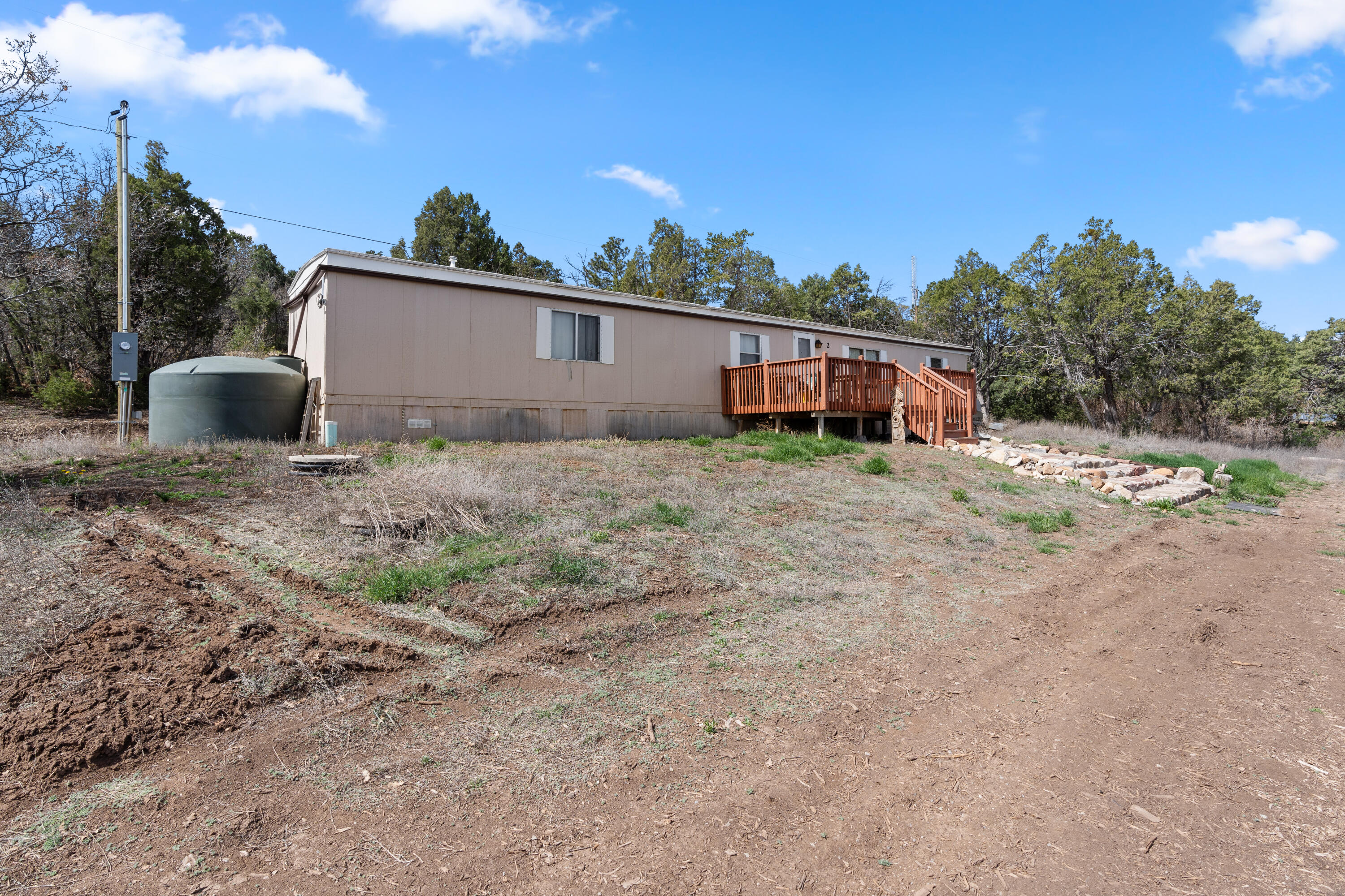 Two bedroom single wide on just over 3/4 of an acre fully fenced located 25 minutes from Albuquerque.