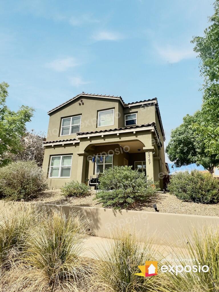 This Raylee Tuscan Home is sure to make an impression.  Corner lot boasts a fully landscaped low maintenance backyard. This home is a Build Green NM Sliver certified helps to keep utility bills in check.  Featuring Low-E windows, Tankless Water Heater and Refrigerated air. 3 beds 2.5 bathrooms are perfectly laid out for practical living. The cozy fireplace sets the ambiance for any occasion in the main living space.  Stainless steel appliance package featured in the kitchen along with granite countertops, eat-in breakfast bar. Brand new furnace recently installed in 2022. Laundry Located upstairs for convince. Spacious Primary Bedroom with a grand closet, en-suite has a garden tub, separate steam shower and a double vanity. Netflix Studio, International School, Grocery Store and Communit