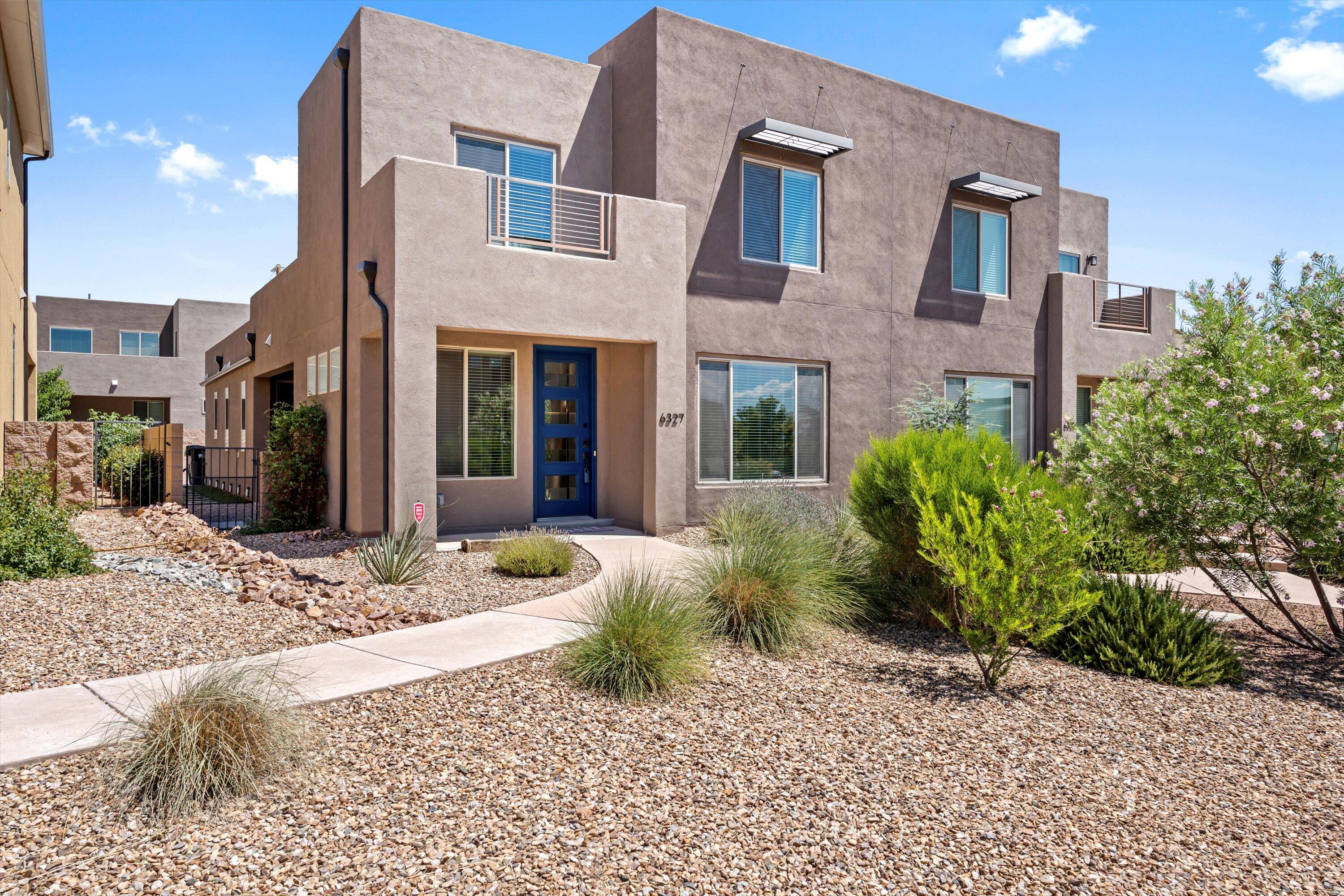Fantastic luxury townhome located in the sought after La Orrila Community! Great open concept floor plan with primary bedroom downstairs.  High end white cabinetry with custom shelving, stainless steel appliances & granite countertops! Upgraded carpet leads to the biggest loft you've ever seen + 2 spacious bedrooms! Low maintenance backyard with large covered patio & Synlawn. Green built with refrigerated air, tankless HWH, Low E Windows & 2x6 construction.  Fantastic location with quick access to Paseo, I40, Bosque Trails, Restaurants & shopping! Washer, Dryer & Refrigerator stay!