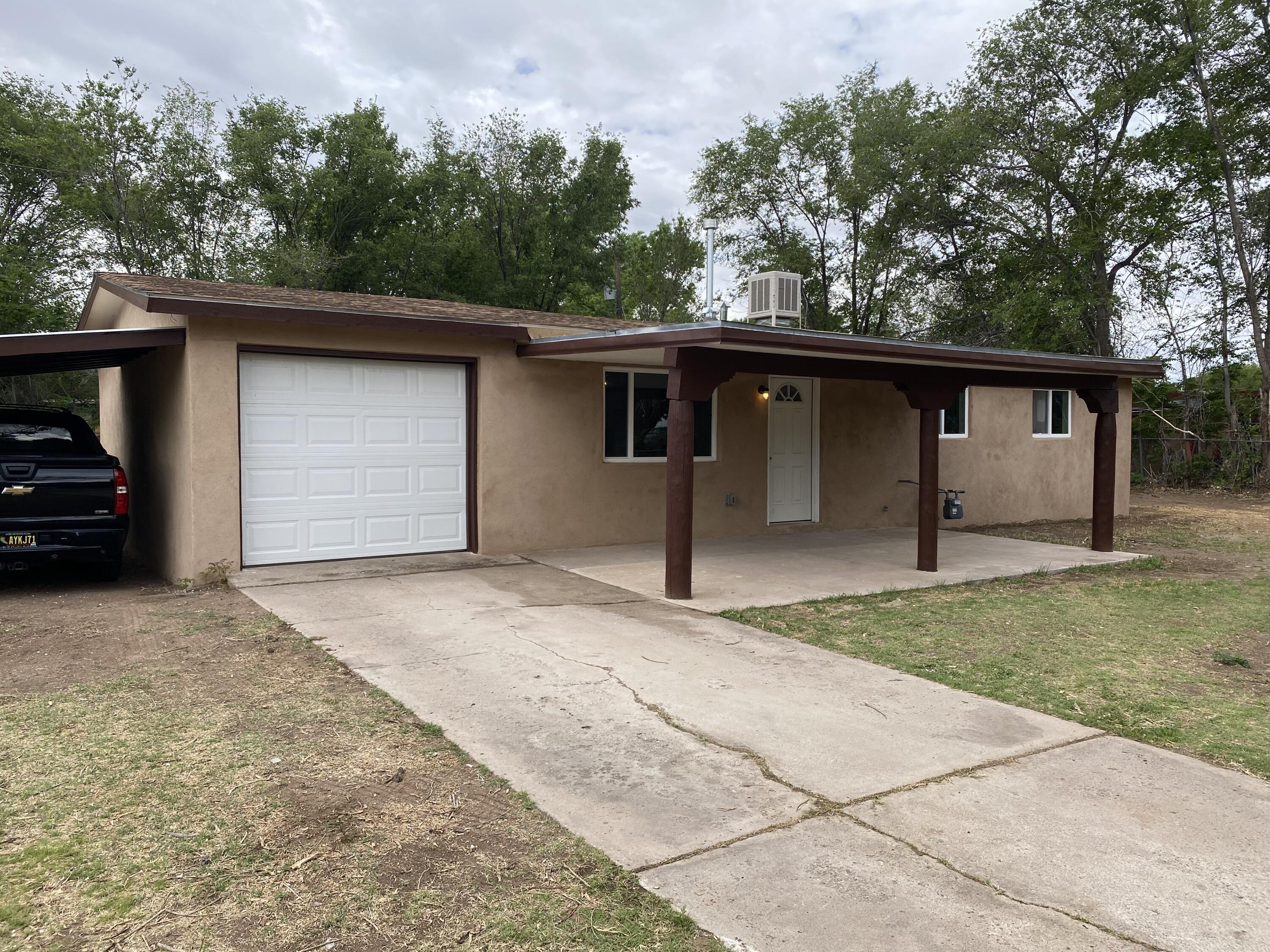Move-in ready. A Charming house with RV parking and plenty of space for upgrades. Home has a make over. Stucco, paint, new windows, new carpet, new kitchen cabinets, new bathroom cabinets, new water heater,  A must see. 3 bedrooms and 2 bathes.