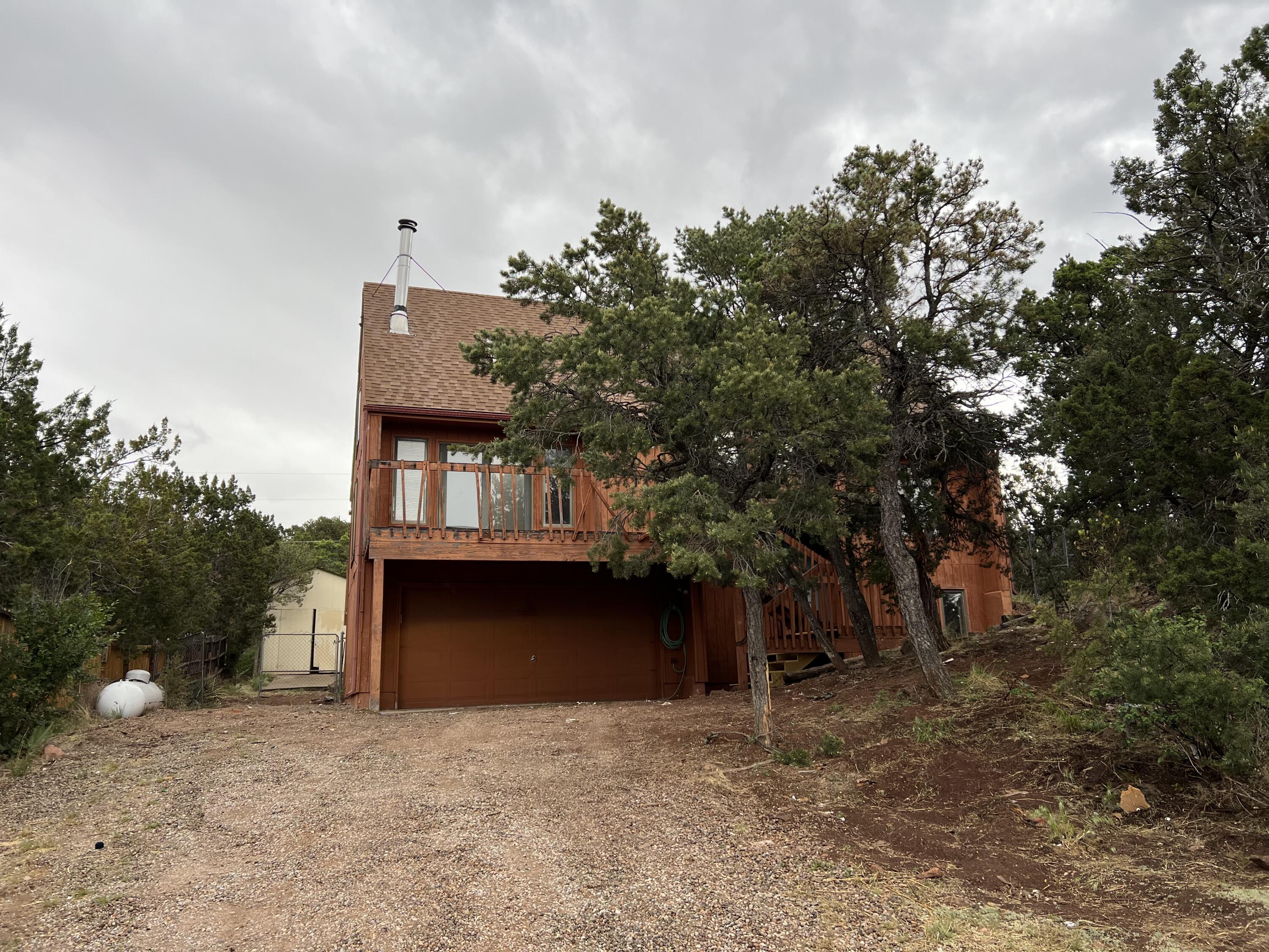 A great opportunity for the saavy investor.  This home has some Amazing Views of the Sandia Mountains.  3 bedrooms, a loft and a 24x12 Bonus Room.  2 Decks (please don't walk out on decks). Mature trees and a space on Earth that will take your breath away.  Storage shed on just under a 1/2 acre.
