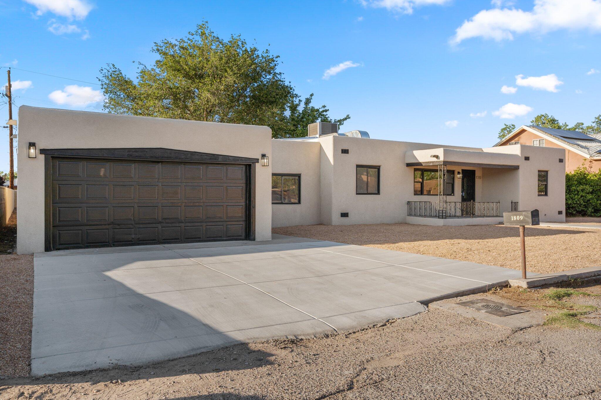 Discover the ultimate in luxury living in Albuquerque's South Valley! This stunning 4bd/2 bath/2 car garage custom home on 1/3 acre is a dream. Upgrades galore - kitchen, baths, flooring, paint, refrigerated air, stucco, water heaters, TPO roof, new appliances, fixtures, driveway, xeriscaping, and more: climate-controlled primary suite, three spacious living areas, indoor fireplaces, outdoor entertainment with fireplace. THERE IS no HOA outside of ABQ city limits, and convenient location, and a low-maintenance front yard. Experience South Valley's charm!