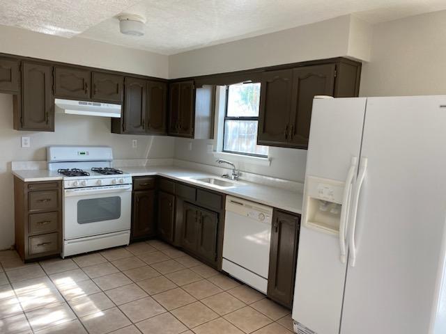 Welcome to this lovely townhome. Newer heater, newer swamp cooler. Carpet was replaced 7 months ago. Brand new quartz counters in bathrooms and kitchen.  Comes with stove dishwasher and refrigerator. Seller is giving a 2500 allowance for closing costs or new windows and rear patio door.