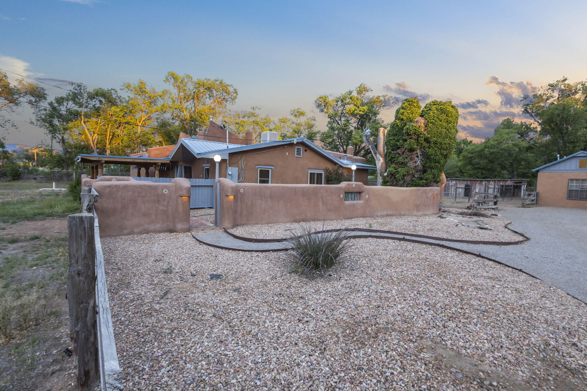 BEAUTIFUL AND UNIQUE, quiet, private, walkable neighborhood with easy ditch road access for hiking, horse-back riding, biking or just walking, classic home with adobe accents, approximately 3075 total square feet, on one full acre, built in the 1940's, remodeled in 2003, addition by Pennington Builders. In addition to main home (2279 +/- sq ft), property has casita (800 +/- sq ft), completely remodeled, with bath, laundry (washer and dryer) and loft area, two car oversized garage, approximate 1300 sq feet, with  heated and cooled work area/man cave in rear area of garage. Fully fenced for horses, goats, chickens, llamas, including horse sheds. Home has a private well as water source (230 foot, drilled by Murray drilling, Bernalillo, in May 2015), city sewer, natural gas, PNM electric.