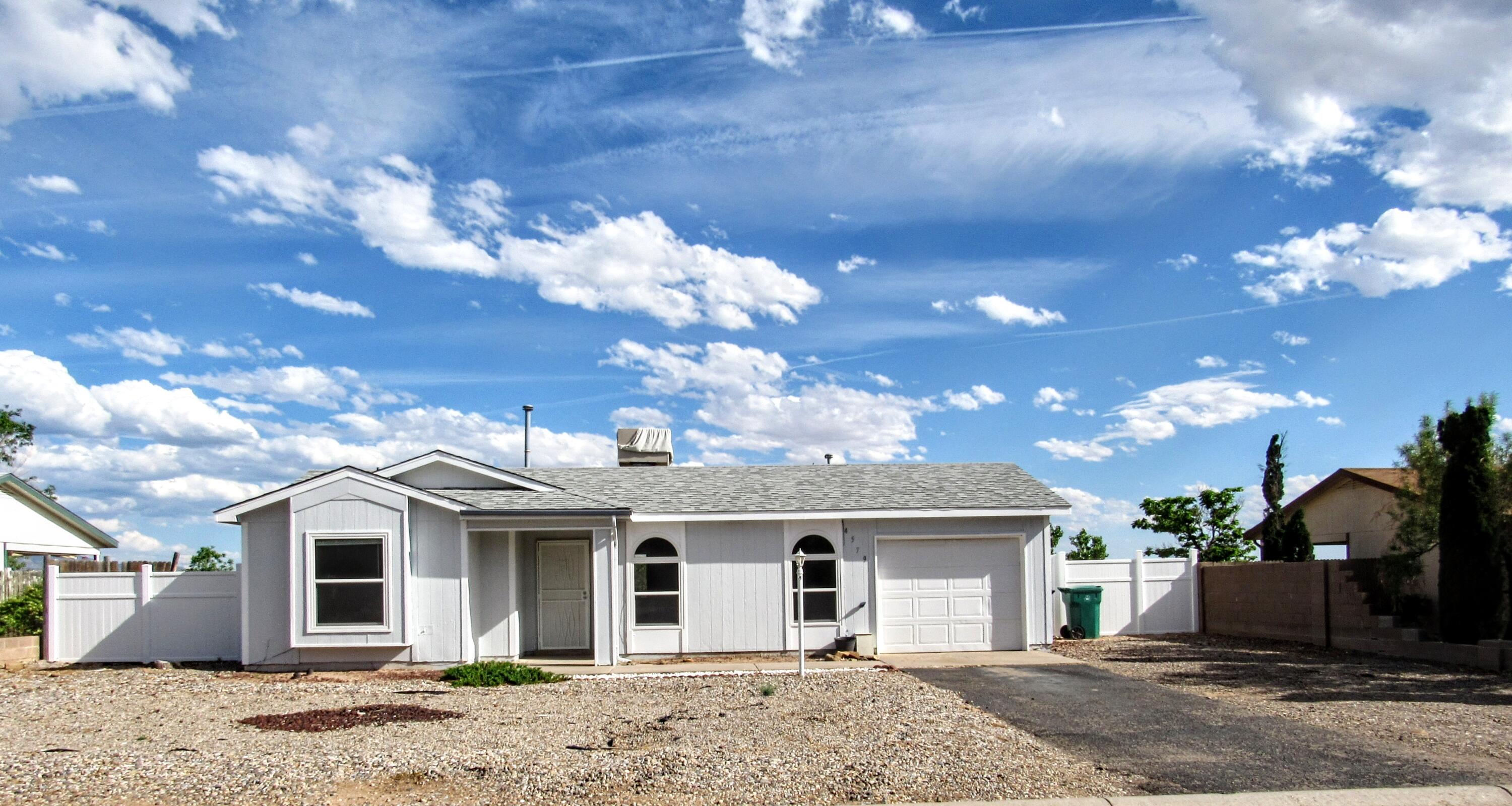 Don't miss this beautifully updated move in ready home perched high up in Vista Hills.  2 bedrooms, 1 full bath.  Fresh paint, new flooring, updated counters and fixtures.  New roof, new windows, newer furnace and water heater.  Outstanding views of the Sandias and Albuquerque lights from the .22 acre lot will take your breath away!  Come see this one today.