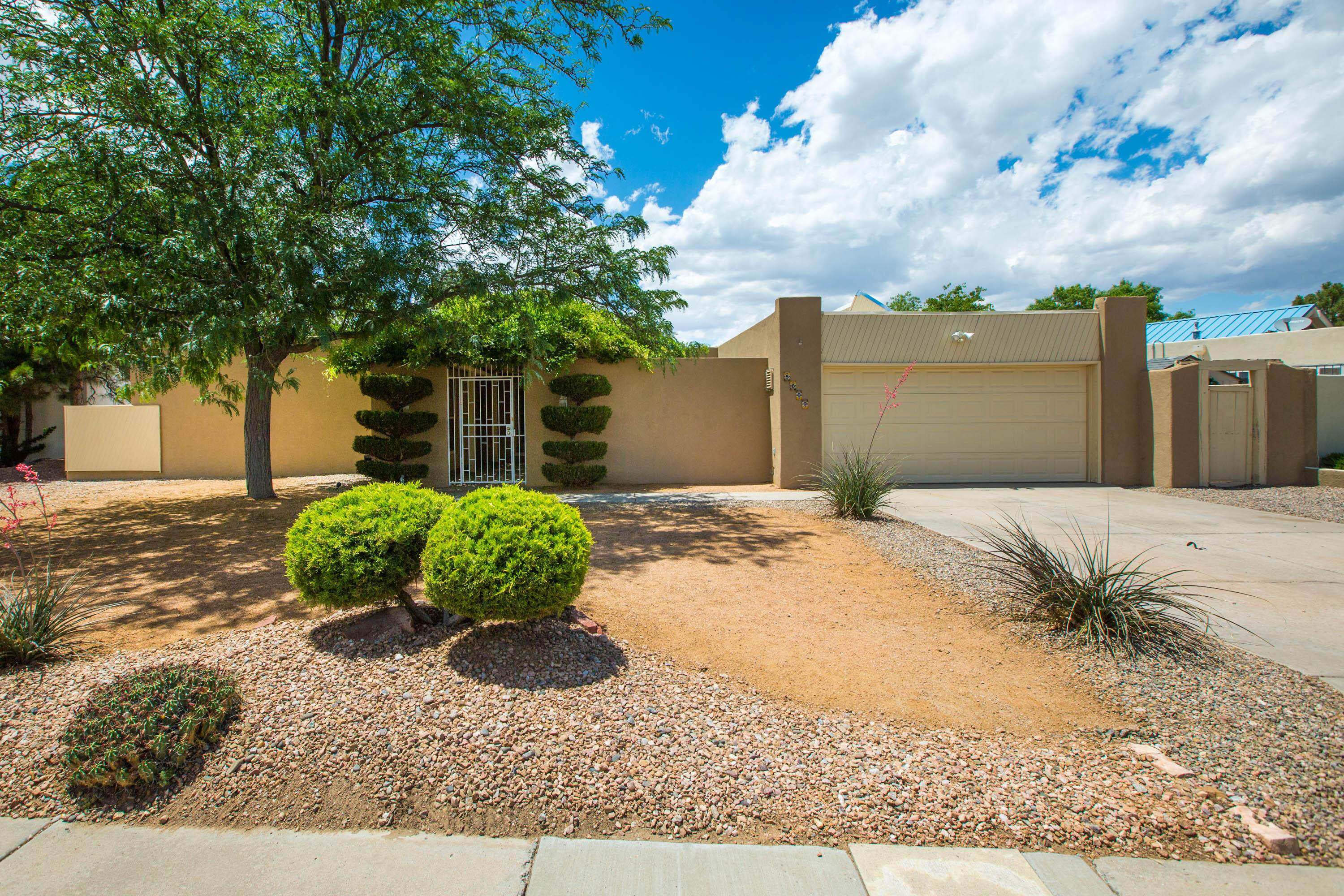 Incredible Find in Bear Canyon Village! Welcome to this Bright, Beautiful, Single-Story, Move-in Ready Mossman Home in Albuquerque's Northeast Heights. *2020 TPO Roof + 2022 Heating/Cooling Combo Unit!* Enter through the gate and 5809 Torreon greets you with a Charming, Wisteria-Covered Courtyard. Updated Kitchen with Granite Counters, Wolf Gas Range, Stainless Appliances, Large Breakfast Nook. Conveniently Located with Easy-Access to Everything.