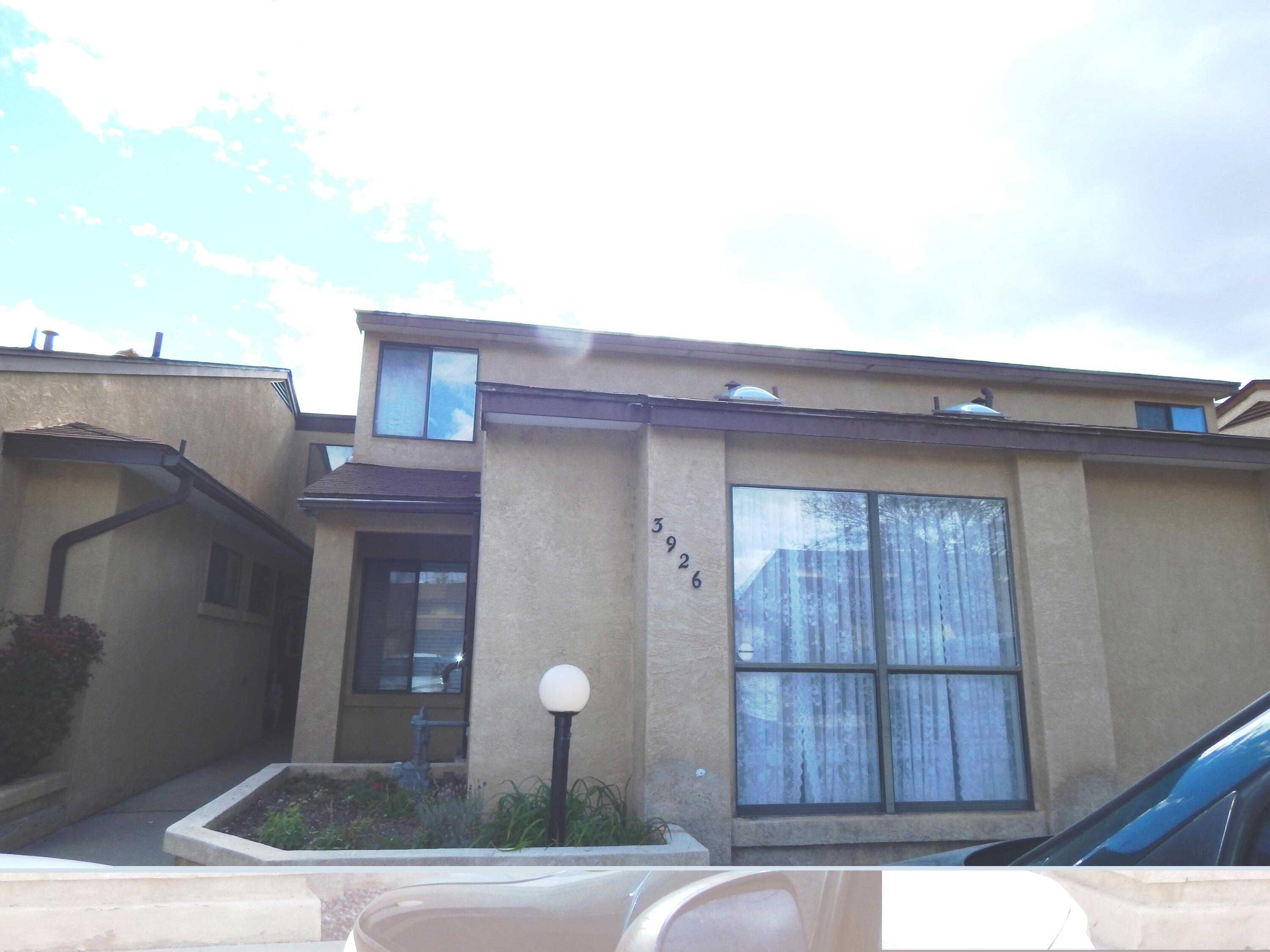 CONVENIENT LOCATION:--- close to shopping, health food stores, post office, fitness, restaurants and more!UPDATES GALORE - including: kitchen cabinets, countertops, appliances, tile and vinyl plank flooring. Lots of natural light and custom designed skylights in kitchen and dining room. Roof and skylight domes replaced in fall 2022. Nice layout with bedrooms located on each side of the townhome and a fenced patio. . There is No Sign on the Property, but don't worry, it is for Sale, so Come and See this cozy and charming home.