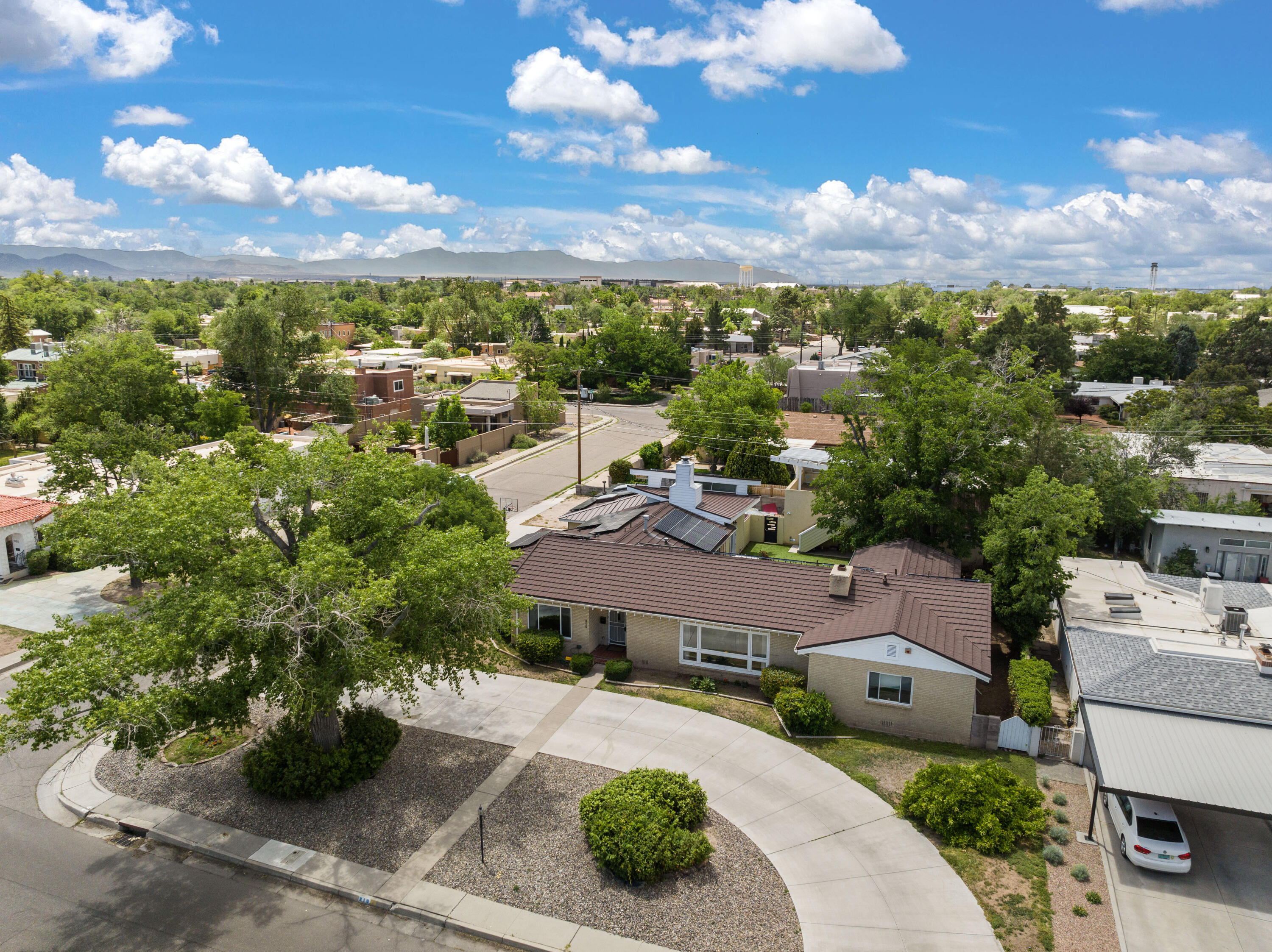 Well maintained home in the desirable Ridgecrest neighborhood. This formal yet elegant contemporary home has 4bd/3.5ba/2cg on a double lot. Beautiful open kitchen w/granite countertops and plenty of cabinets for storage, light and bright w/gorgeous oak floors throughout. Home has a metal roof and solar panels. As you walk in the door the home boasts of light and space, the view of the mini-park across the street is such a beautiful sight!  The home has an addition of a master suite; there are 2 master bedrooms and two guest bedrooms. The other addition is a detached 2 car garage, gym, a large storage space and a beautiful balcony for early morning coffee or an evening place to relax. Schedule a showing today!