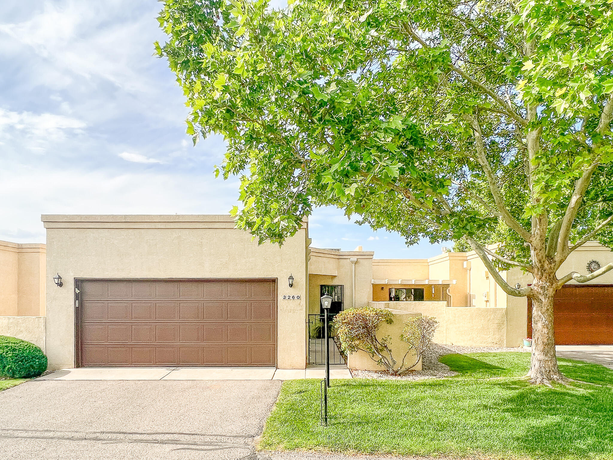 Enjoy expansive mountain views or city lights from this beautifully maintained home in Rio Rancho. Located in a well-established and desirable 55+ neighborhood. Move-in ready, single story home with fresh paint, newer carpet, new water heater & all appliances convey. Lots of light in this well planned floorplan. 2-car finished garage with work area/bench. Enclosed indoor atrium.  Large updated kitchen, with cherry cabinets & granite countertops, opens to dining area/ living room with custom gas fireplace.  Primary bedroom with private large bathroom, over-sized shower, & large walk-in closet. Second bathroom has full bath.  Third bedroom could also be an office/den. Screened in patio offers additional living space to enjoy the beautiful views. TPO roof, refrigerated air, & new water heater