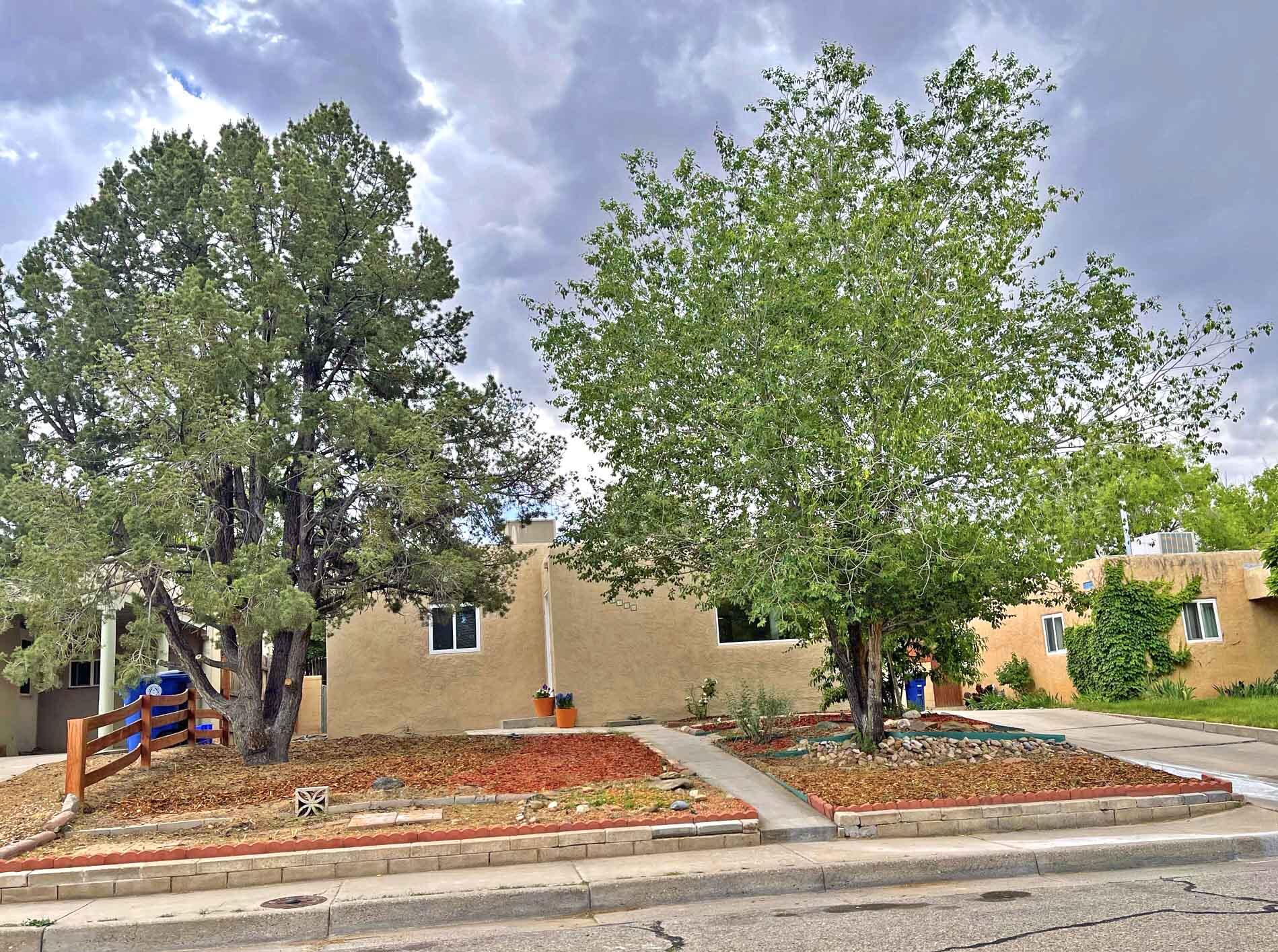 Charming Home near Ridgecrest in Victory Hills area SE Heights with Nob Hill, UNM, & the Airport just a short distance away. This custom 3 bd, 2+ bath home has tons of potential, being sold  with all the appliances. The roof was recently replaced & upgraded to TPO and has a transferable 5 yr warranty to the new Buyer. New stucco coat. Brand new carpet in the west bedroom with separate entrance. Two large living areas! Original refinished wood floors in front part of home. Large 140 sf workshop/storage in the backyard. Home is freshly painted. Walking distance to Bandelier Elementary & the sport stadiums. Home is in a nice quite neighborhood with lots of parks to enjoy nearby. See attached Seller list of Updates. Be sure to put this one on your list!