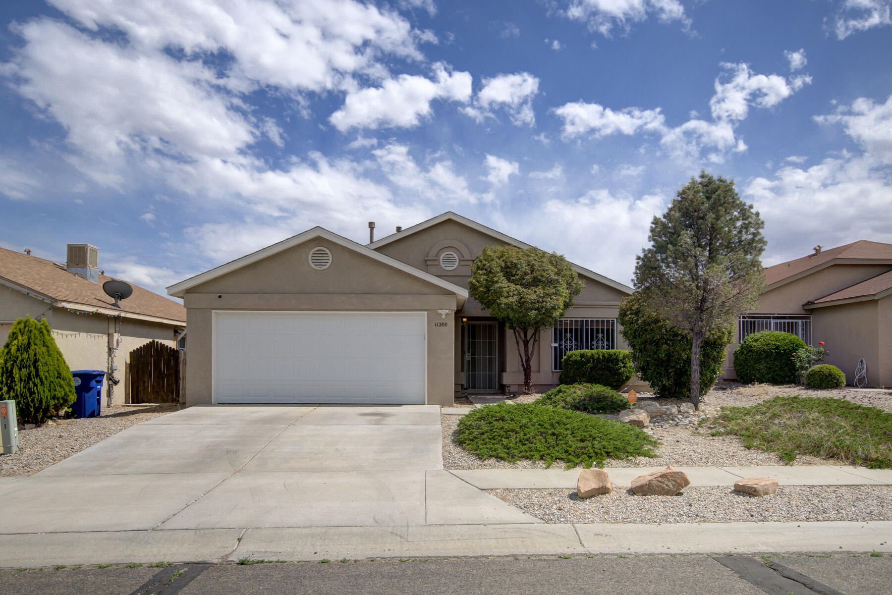This beautiful updated home is ready for move in with all new fresh paint, vinyl plank flooring, & carpet(2023), newer roof and evap. cooler (2018)!! As you walk in the door you are greeted by a huge living room area with tons of natural light. The dining room area and kitchen are just off the living room with freshly painted cabinets, stainless steel appliances, and tons of cabinet space making this a chef's delight.  The large master suite has a walk in closet, new carpet, and full bath with freshly painted cabinets. The other two bedrooms are also good sized, new carpet, and one with walk in closet. Comes with all appliances including washer and dryer. The back yard is perfect for entertaining with the full covered patio and xeriscaping gives tons of privacy. Must see in great location!