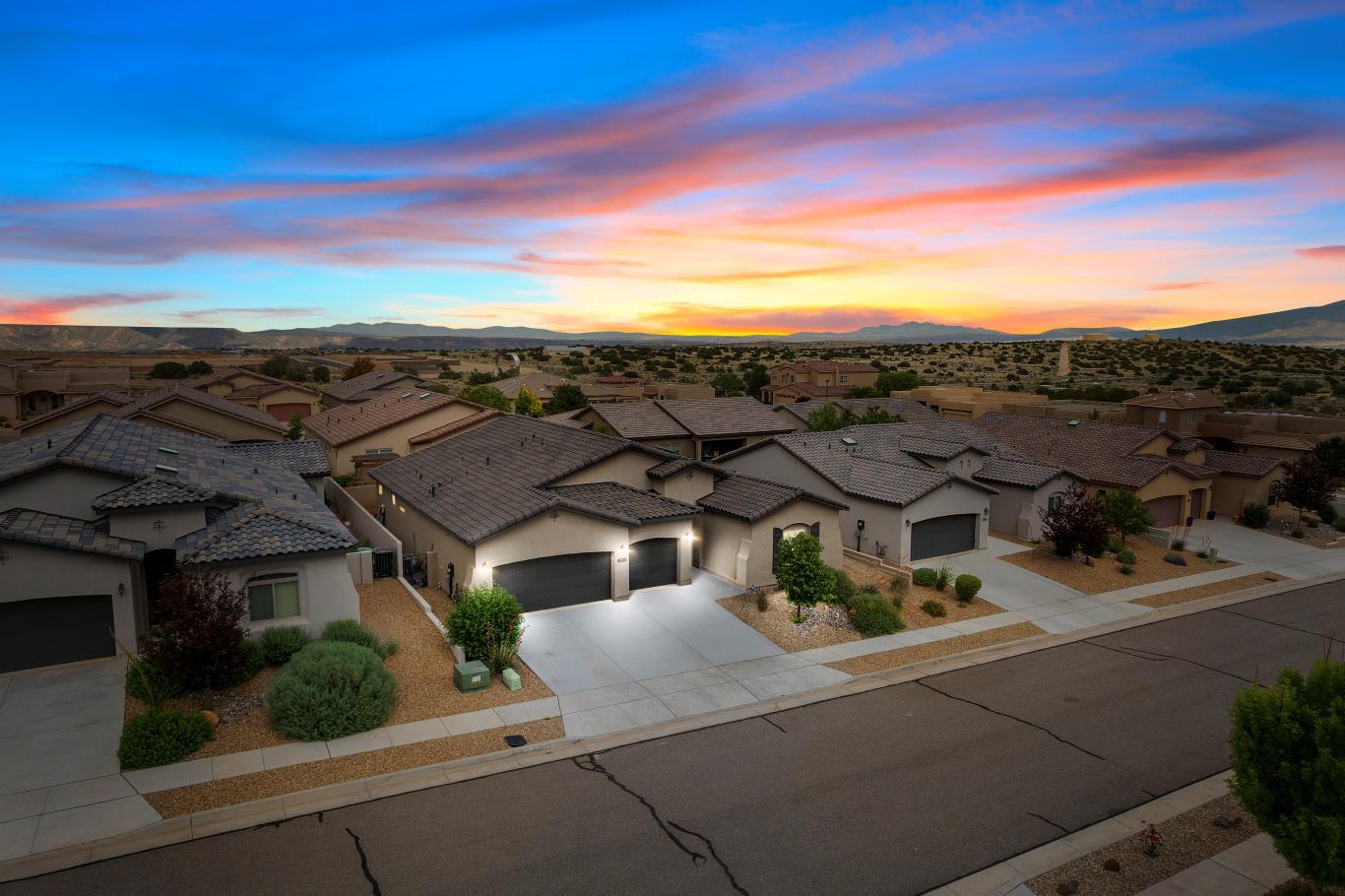 GORGEOUS 3 BED/2BATH/3 CAR Abrazo home with tons of upscale features and located in desirable HOA with ALL THE AMENITIES! Step inside to contemporary 8-ft interior doors, modern wood look tile flooring complemented by beam ceilings with an open layout seamlessly connecting living, cooking, and dining! Open the sliding doors to the patio allowing for seamless indoor-outdoor enjoyment. Tranquil master with walk-in closet and master bath with double sinks and separate shower. Cook's kitchen with sparkling quartz counters, pendant lighting, pantry, and kitchen island with ample bar seating. Beautifully landscaped front and back designed for low maintenance and maximum enjoyment. The Mariposa Community provides access to pool, community center, gym, coffee shop, basketball, and more! COME SEE!