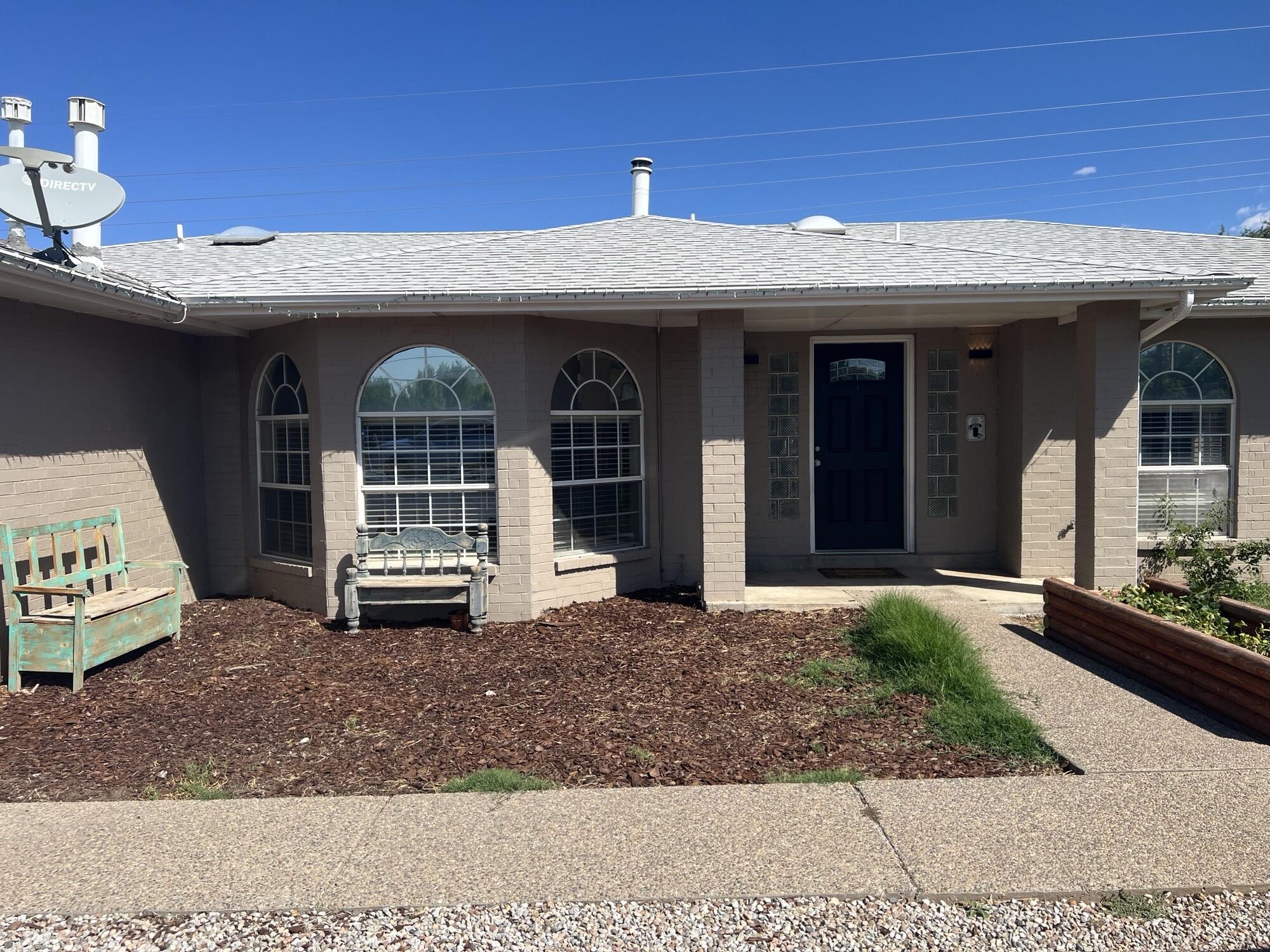 Unique North Valley property conveniently located just west of the El Pueblo Rail Runner! Open Floorplan! Large Living/dining/kitchen area. 2 Large bedrooms and a 15x21 Master bedroom with a 12x20 Master bath that has 2 walk in closets! All built around a central courtyard. Enjoy the comfort of radiant heat and convenience of the central vacuum system. Brand New Flooring! 14x18 Workshop with an overhead door. Almost Half Acre Lot! Must See!!!