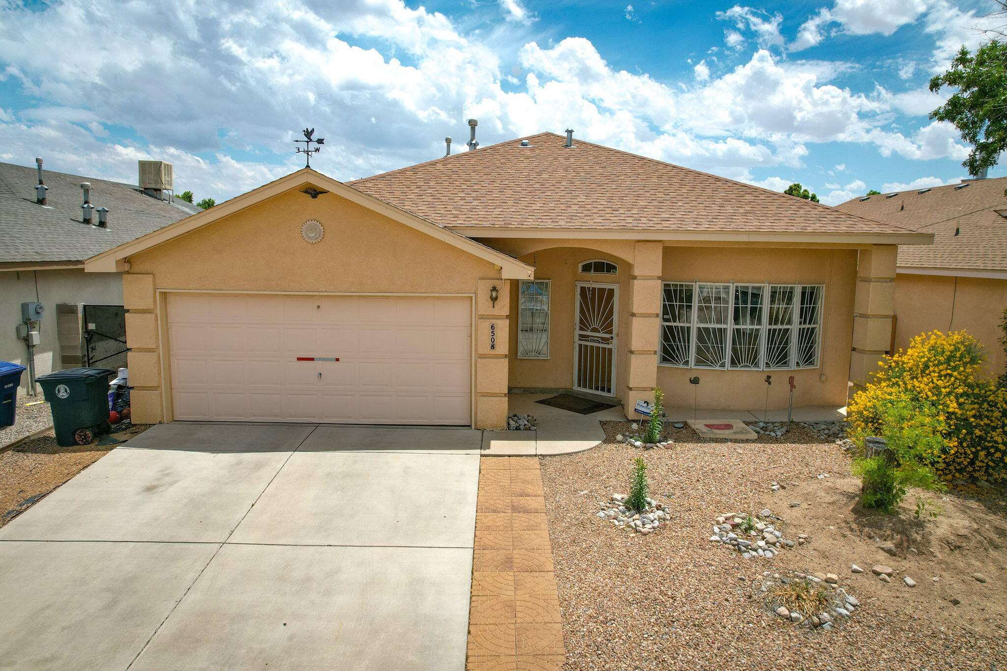 Custom built in 2003, this stunning single story home features three bedrooms, two bathrooms, oversize two car garage, with solar panels, in the convenient Kensington Subdivision, close to shopping, schools, churches and close freeway access. As you enter the home through the front privacy door, you will have a very roomy main living room.  The open floor plan includes raised ceilings and skylight in the kitchen, with adjoining pantry, seating at the island, French door fridge, stove, microwave and dishwasher. Adjoining dining area has spacious seating, generous dining area and backyard access through double security doors.  Luxurious owners' suite boasts double entry doors, high coffered ceiling, excellent natural light and huge walk in closet.