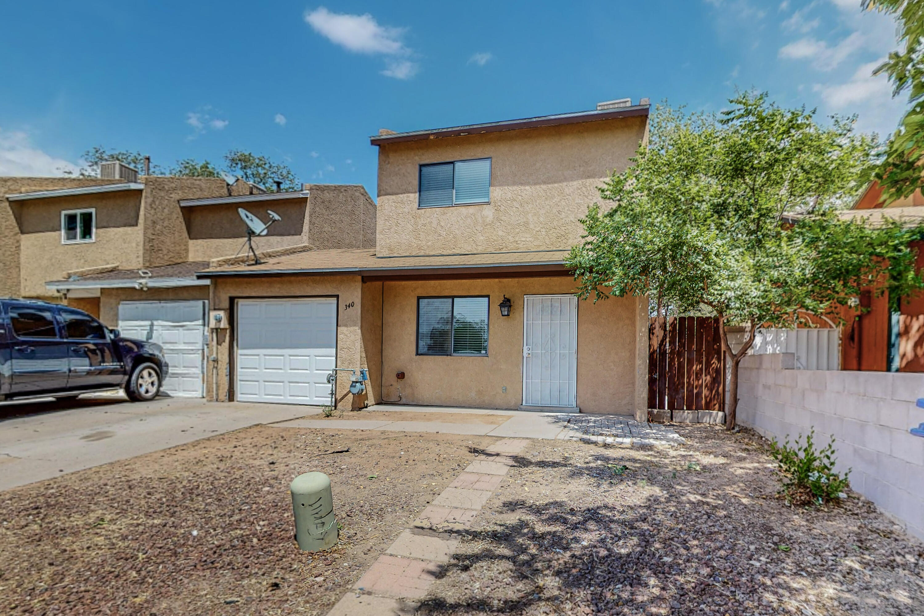 This charming home close to the base, shopping, and UNM has recently been updated with fresh paint throughout the interior, making it bright and inviting. The bathrooms have also been renovated, giving them a modern and sleek feel. The garage door has been replaced with a new one, ensuring that your vehicles will be safely stored. There's also a new hot water heater, giving you peace of mind knowing that you'll always have hot water when you need it.The kitchen is sure to catch your eye with a less than a year-old fridge and stove ready to use. You can be sure that the appliances are in great working condition. Plus, you'll love the convenience of cooking in a modern kitchen with these features.