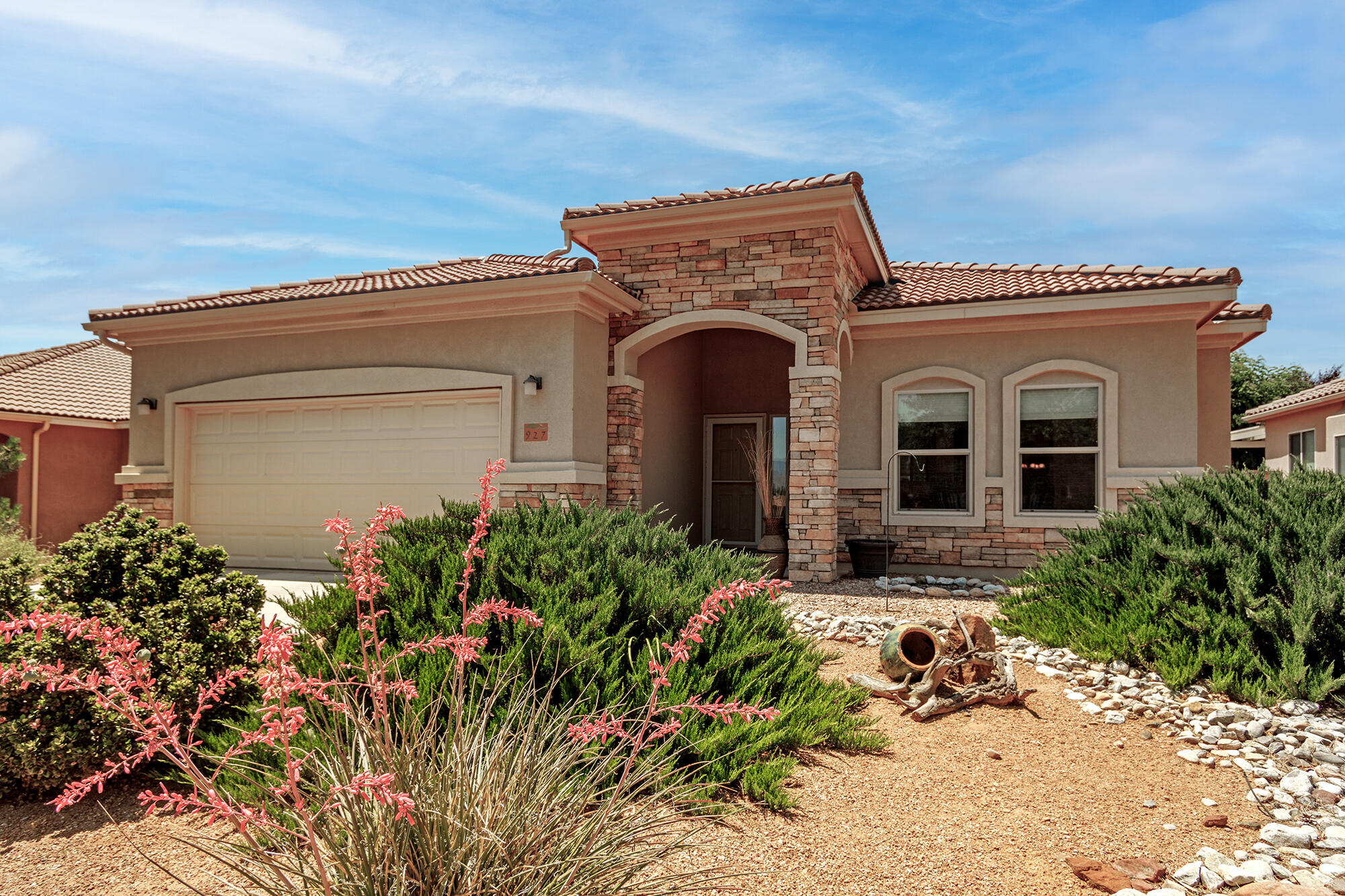 This delightful Taos floor plan offers 3 bedrooms and 3 bathrooms. Its open layout is perfect for both daily living and entertaining. The kitchen boasts 42-inch upper cabinets, stainless steel appliances, large island and walk-in pantry.  The great room showcases a stunning custom built-in bookcase. Floor plugs provide flexible furniture arrangement.  Take pleasure in the serenity of the private backyard while relaxing on the spacious covered patio.  Within this tranquil community, you'll find a host of amenities to enhance your lifestyle. The gated entry ensures security and peace of mind.