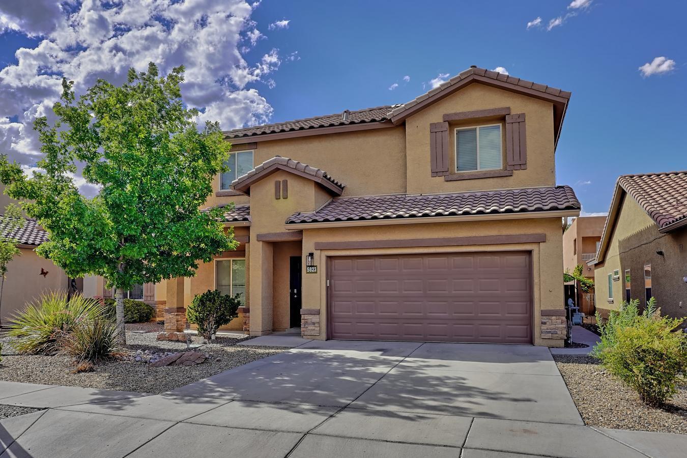 Welcome to this Stunning Custom Home with over $75,000. in Recent Upgrades! Open Plan Features a Spacious Family Room open to the Completely Remodeled and Upgraded Kitchen! New Custom Cabinetry! Quartz Counters! High-End Wood Look Laminate Flooring! SS Appliances w Gas Range! Designer Lighting! Decorator Paint! Main Level offers a Bedroom and Full Remodeled Bath, ideal for in laws or guests!  Upper Level Boasts 3 bedrooms and a Huge Loft! Loft is perfect Flexible Use Space, Now a Home Theatre!   All Baths have been Remodeled! Luxurious Owner's Suite Boasts Gorgeous Spa Bath Retreat at Home! Fabulous Outdoor Living in a Professionally landscaped yard featuring a Pergola and Faux Stone Firepit! Expansive Patio! Tankless water heater!Oversize 2 car garage w/ Epoxy Floor