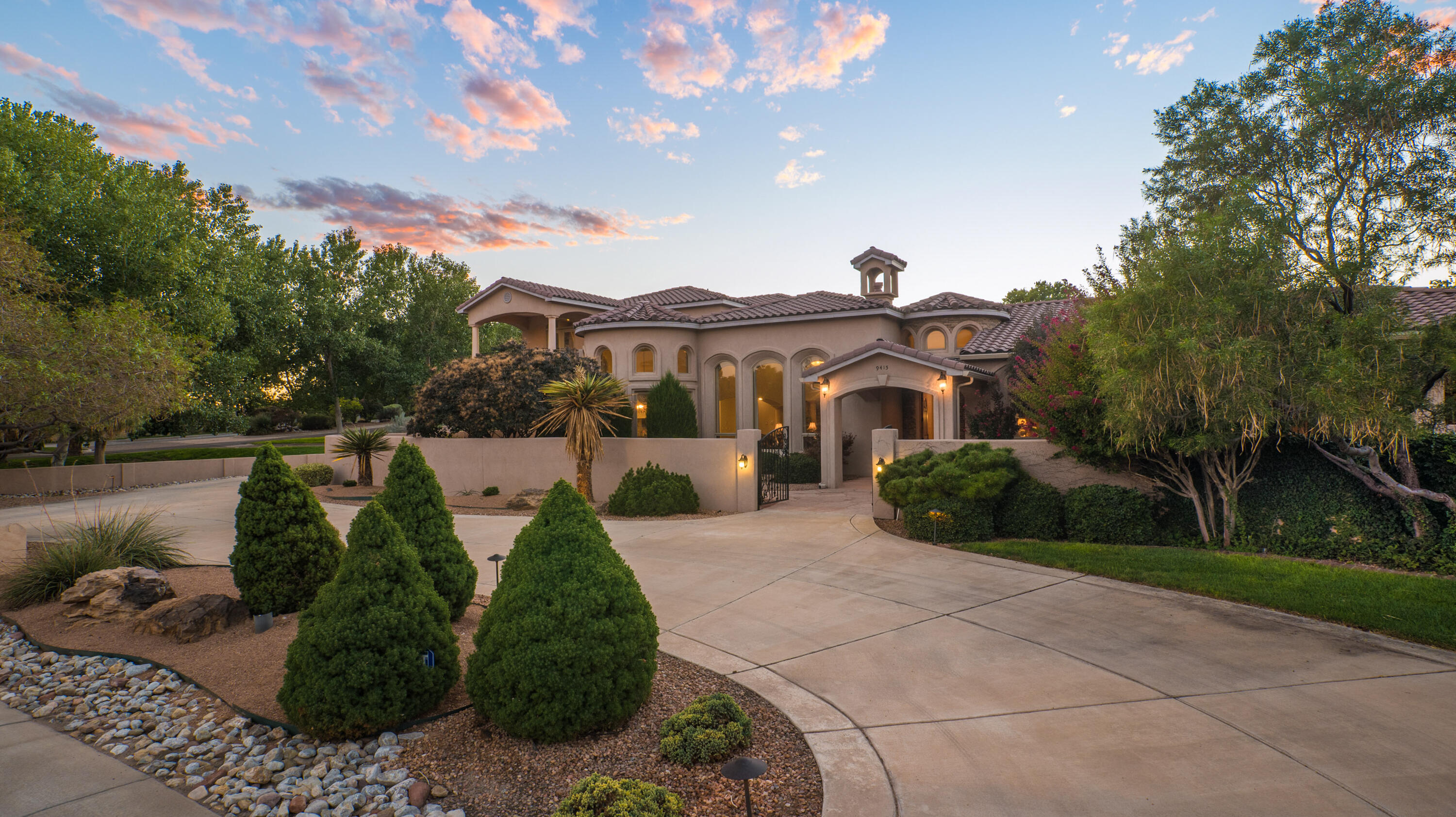 This incredible custom built Mediterranean style estate has been lovingly maintained by the original owners. Beautiful and classic finishes include hand trowled plaster walls, timeless travertine flooring, handcrafted custom cabinetry, rich granite, beautiful alder interior doors, Pella wood windows, and designer lighting. This flexible floor plan offers 4 bedrooms all with en-suite bathrooms, two of which are primary suites on the main floor. There is also an oversized, finished 4 car garage. The large lot offers privacy and beautiful mature landscaping. A deep covered patio with a fireplace and outdoor kitchen offers great outdoor living space overlooking the lush backyard. Enjoy the convenience of location with quick easy access to shopping, dining, entertainment and services nearby.