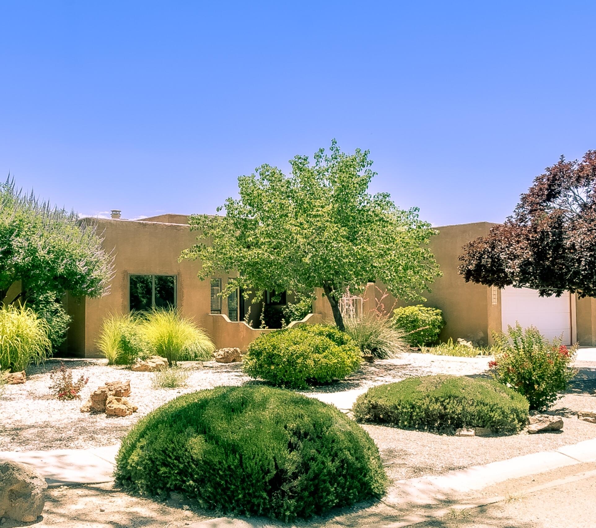 Original owner, one-level home on a lush and lovely .25+ acre lot in the Near North Valley! Open floorplan with two living areas and two dining areas. Two fireplaces. High ceilings. Brick floors in entry and kitchen. Kitchen has island cooktop and window seat. Large primary suite with two closets and atrium doors to backyard. Two more bedrooms + full bath. Lots of skylights. Refrigerated air. Laundry room; washer/dryer convey. Two covered patios, wood deck and storage shed. Beautifully maintained and manicured backyard with green lawns, flowers, paths and trees. Xeriscaped front yard + entry courtyard. Automatic watering. Double garage. Built in 1988. Located on a no-through street just east of Rio Grande Blvd.