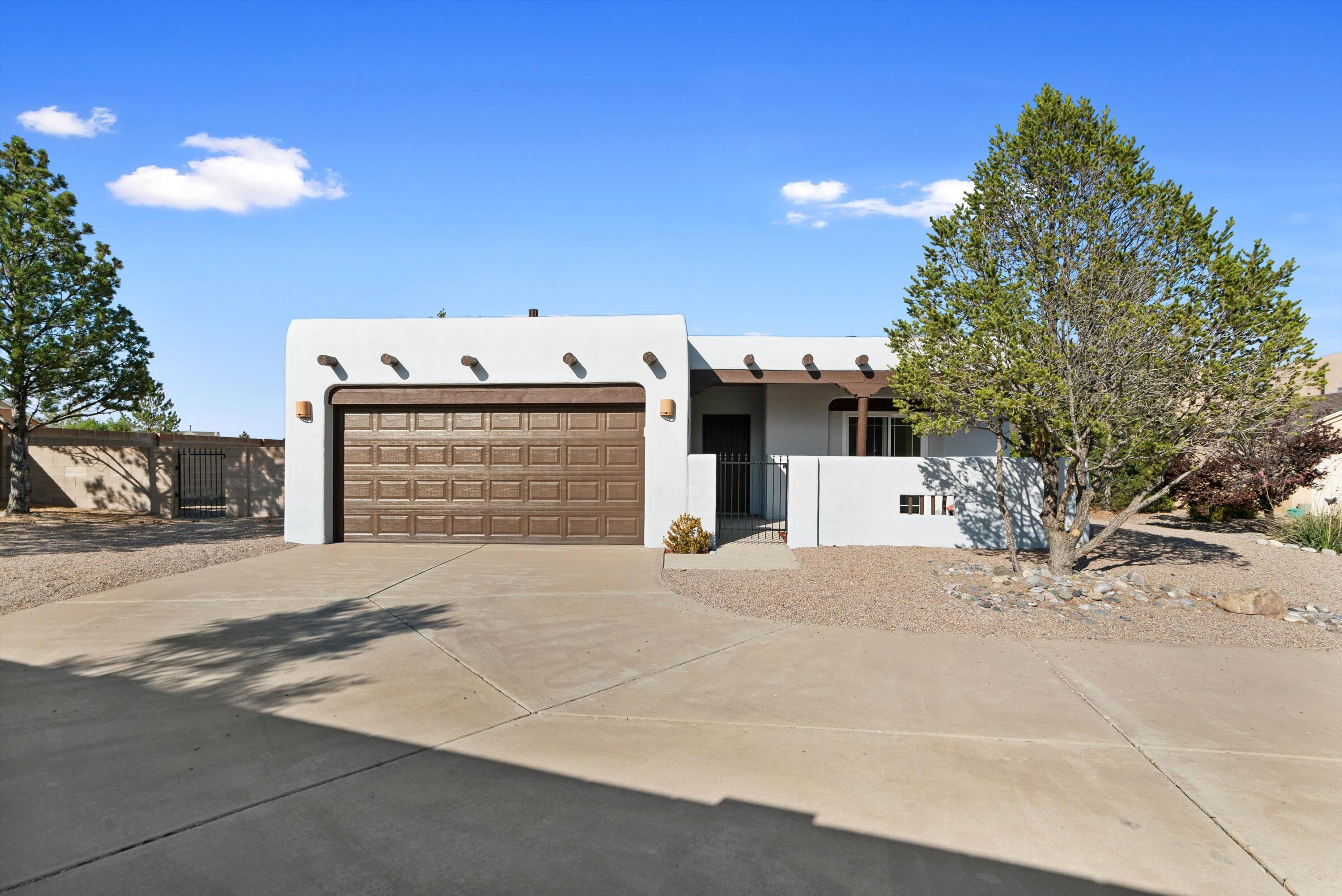 Welcome to this beautifully renovated home on one of the largest lots in Ventana Ranch.  This home sits on nearly a 1/3 acre lot and has nice views of the Sandias.  Updates include all new stucco, recent HVAC, new windows, some new flooring, new kitchen including cabinets, counters, backsplash and appliances.  You'll love the layout of this home featuring a large living room with high ceilings, vigas & a kiva style fireplace.  The primary bedroom is spacious and features a lovely bathroom with dual sinks, garden tub and tiled shower with a brand new glass door.  Enjoy the summer nights on your screened in back patio.  This home has had lots of money invested in it in the last 2 years, now it's ready for a new owner.  Come and see it today.