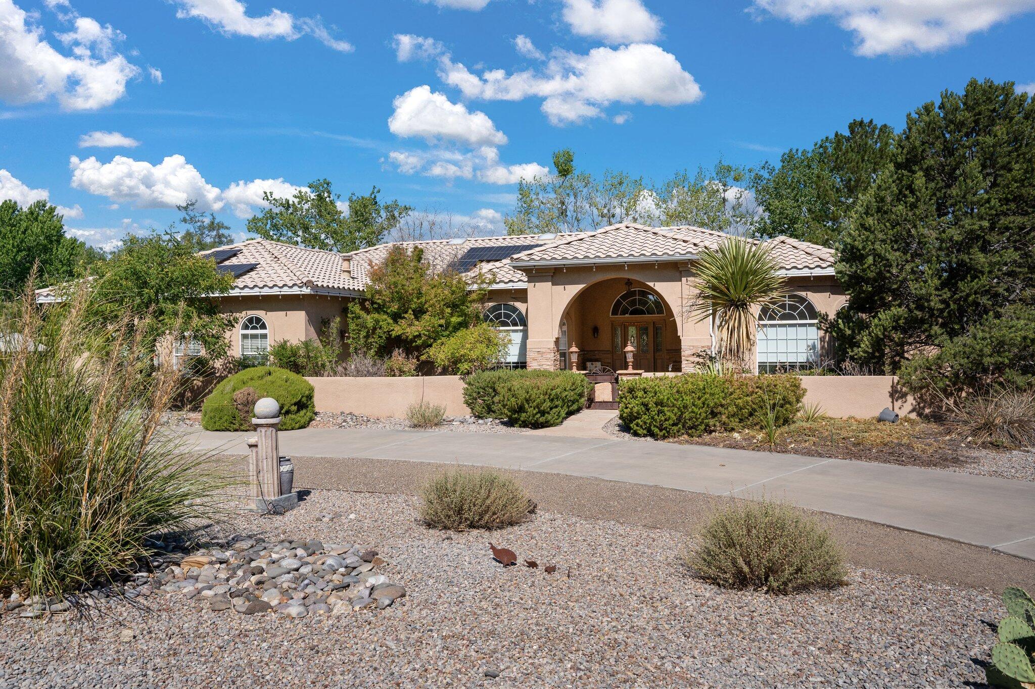 Single level, custom Rutledge located on an acre in the beautiful Riverfronte Estates subdivision. Quintessential Rutledge amenities include excellent curb appeal, classic columns, crown molding in the formal living room & cathedral ceilings in the family room!  Owned solar!  The kitchen has granite countertops, newer stainless appliances, reverse RO system & excellent storage.  The primary suite has a French Door entry, private access to a side courtyard- the primary bathroom has granite countertops, double sinks, jacuzzi bathtub, remodeled shower w/ seamless glass door + his & hers walk-in closets. Located w/ easy access to the bosque, trails, Paseo Del Norte, Coors, shopping, restaurants & more!  Schedule your private showing today!