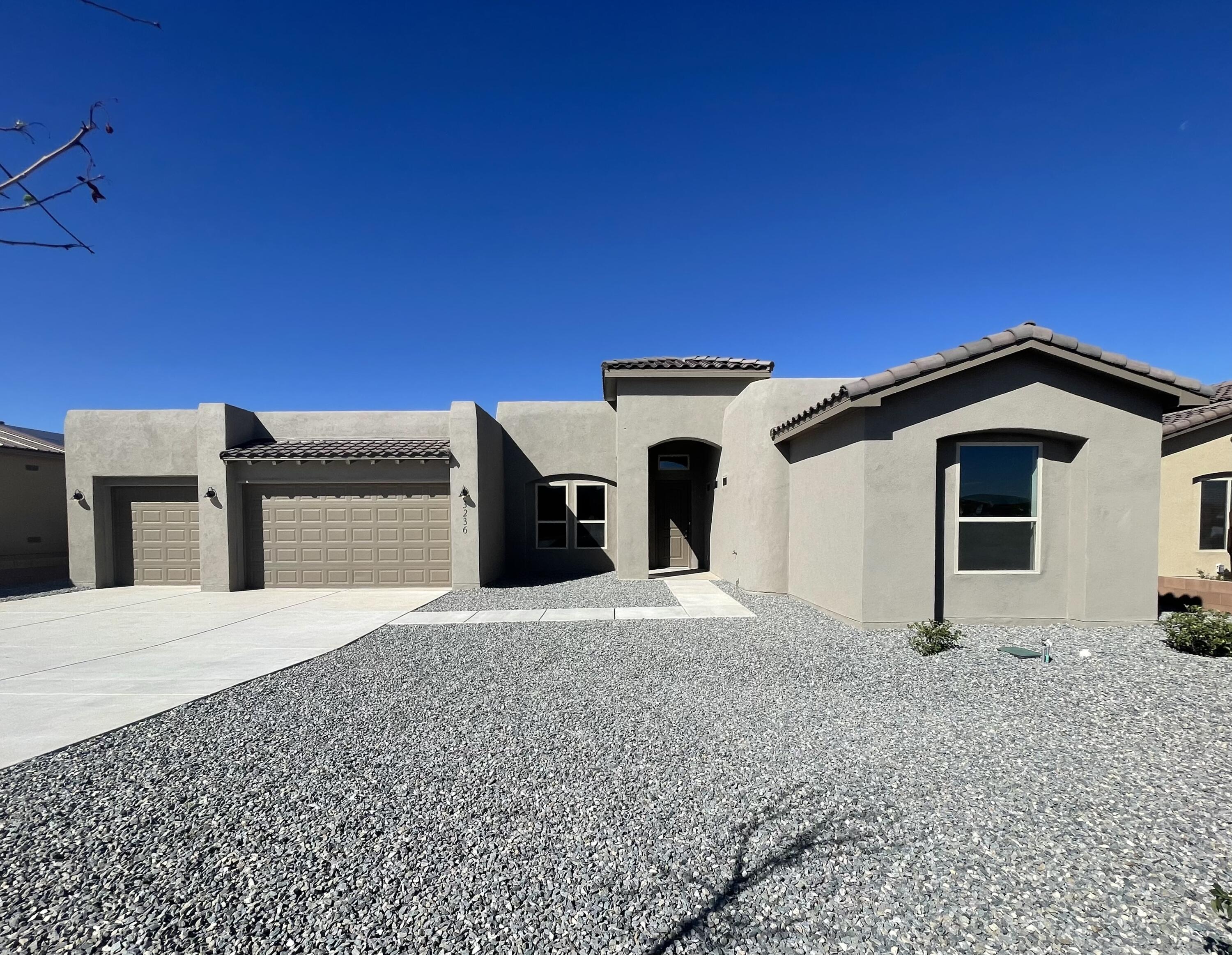 Newly Completed New Construction. This gem sits on a half acre with paved roads, all city utilities, and a view of the Sandias from your back patio. The home features a separate wing for bedrooms 2 and 3, while the master enjoys views out the back.Come check out this home today or talk with the listing broker about your options to build.