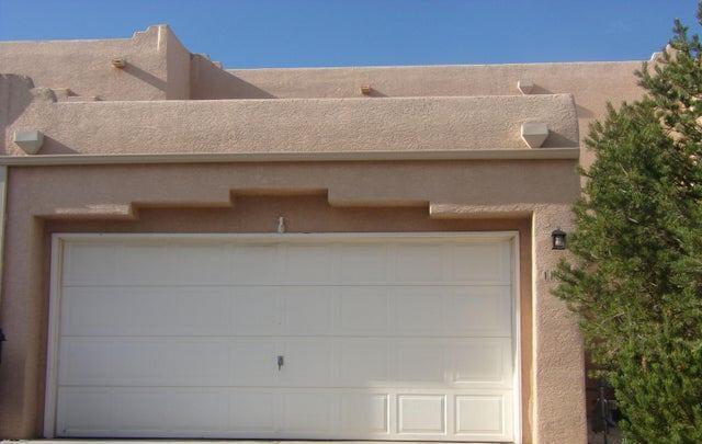 Replacing evap. cooler & water heater, some repairs from inspection being completed.  With acceptable offer, and successful closing, seller will credit $8,500 to buyer towards a new roof. 4 bedroom, 2.5 ba, 1,840 sq. ft., 2 car garage home in convenient and quiet NE Heights neighborhood.  One bedroom  downstairs, family dining area, kitchen with double sinks, freestanding gas stove / oven, built-in microwave, laundry closet, disposal, large living room with gas, glass-door fireplace, sliding door to backyard.  3 bedrooms and 2 full baths upstairs with small loft.  Trees and vines in fully fenced and walled, private backyard with combo patio.  Catio built into back yard for safe outdoor space for your cats.  Close to highways, restaurants, shopping and public transportation.