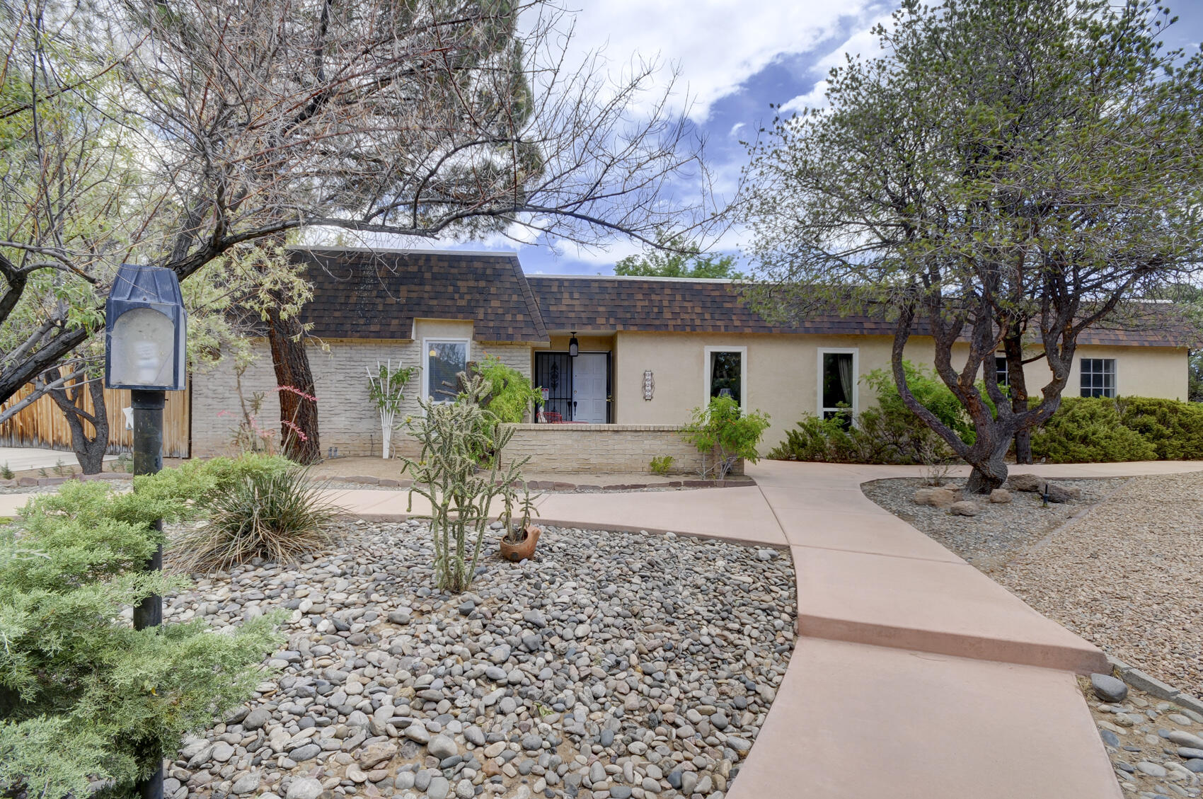 This Lovely Home sits on Larger Corner Lot and Beautiful Mature Landscape. The home is situated near the Golf Course in the Well Established Paradise and Golf Course Neighborhood. It boasts of 4/5 Spacious Bedrooms or 4 bedrooms and an Office, Walk-in-Closets, 3 baths, Two Spacious Living Areas, Cozy Fireplace, Dining Room, Updated Wood Floors, Saltillo Tile, Newer Master Cool, New Windows in Kitchen and both Living Areas, Refrigerator and Convection Microwave stays, Newer TPO Roof redone six years old, Oversized Garage with Workshop Area. The Backyard Includes, Covered Patio, Gas Line for Grill, Shed, and Backyard Access!! This Fabulous Home has so much to offer, in a Great Location, and will not last! Make an Appointment to see it today!!