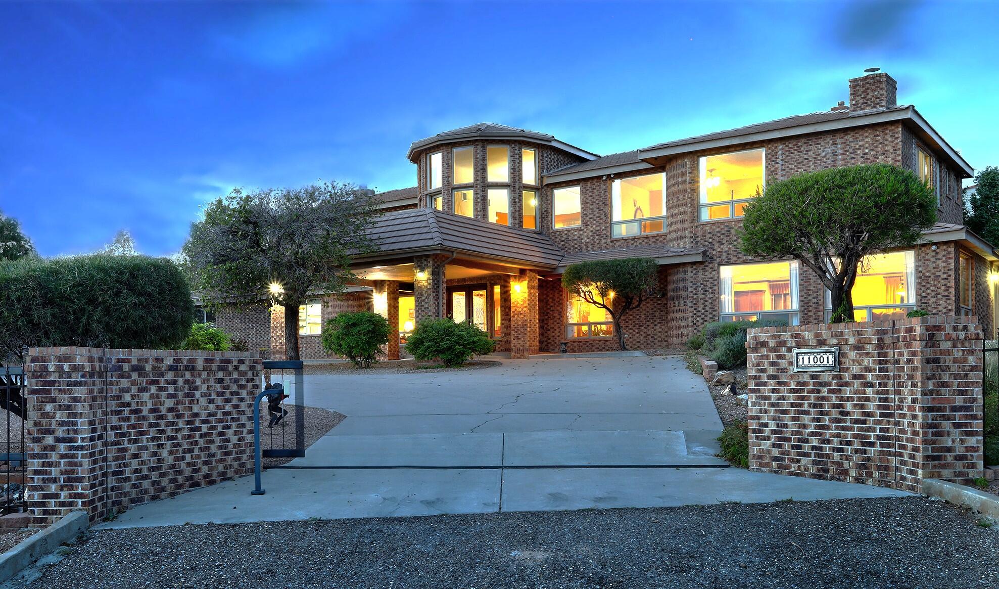 OPEN SUNDAY OCT 8.  2-4pm .Elegant Custom home overlooking the Tanoan Golf Course w/mountain & city light view!Your own Fully fenced & gated sanctuary. Elegant brick construction w/room for all your loved ones AND your hobbies & toys. Floor plan is perfectly suited for multi generational living w/2 primary bdrms, one on the main flr. 2 laundries.Beautiful kitchen in the center of the home w/custom designed deep granite counters,island w/vegetable sink. 2 dishwashers,Warming oven, & 2 pantries. Upstairs find additional family rm w/view deck, 2 bdrms each w/private bath, office, workout rm & luxurious primary bdrm w/sitting room to enjoy sparkling city lights beyond golf course, 2 frplcs & large bath. Heated/cooled Oversized 4 car garage. Room for RV or boat parking.