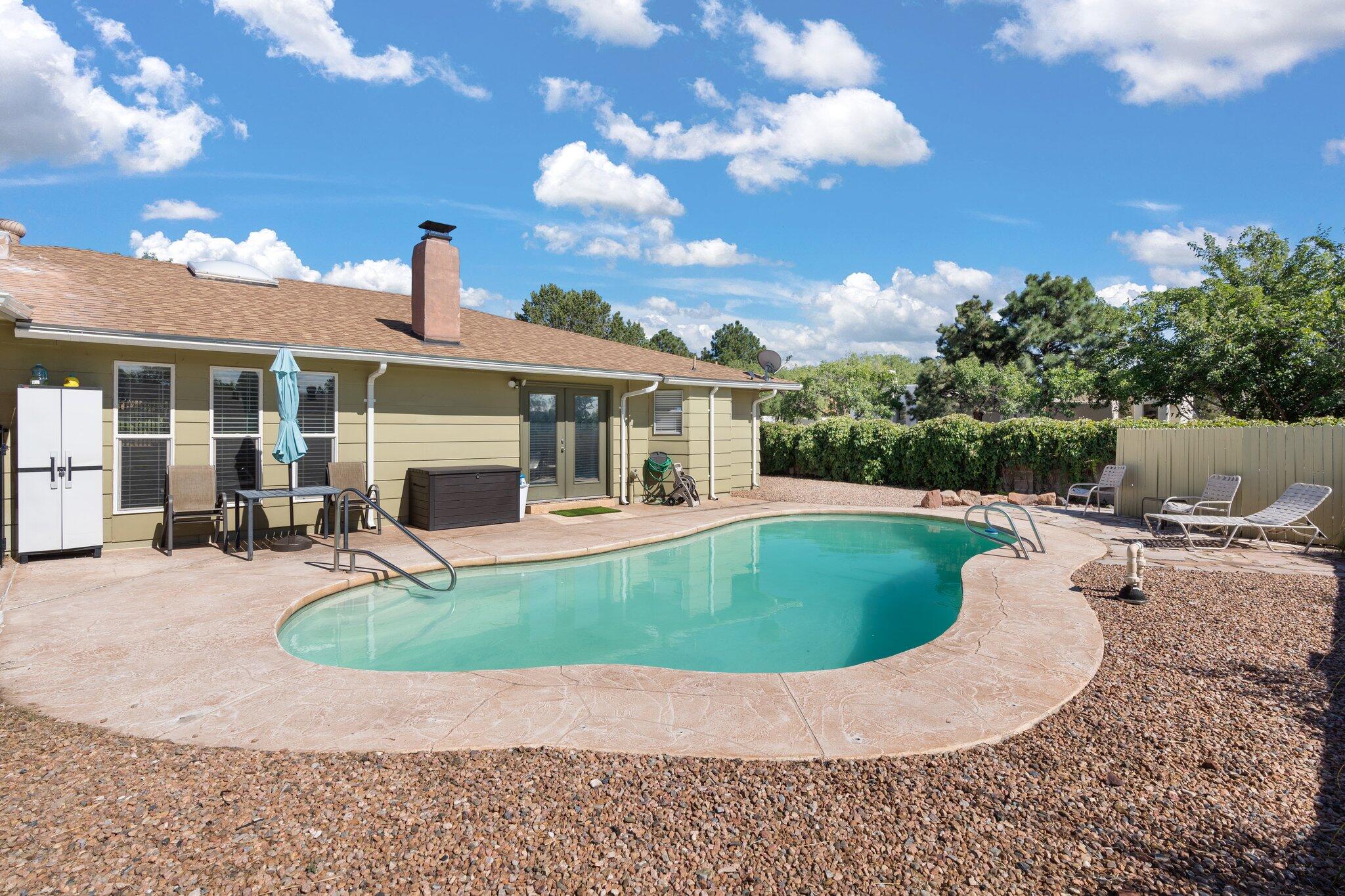 This wonderfully remodeled and updated home is the retreat you've been searching for! This 4, Possible 5 bedroom, 2 bath, 1971 sf has an open floor plan, natural light, updated laminate wood flooring, stainless steel appliances, updated lighting, cozy studio/office space, new windows throughout, excellently maintained.  Updates since 2020 include: Refrigerated Air and new furnace, complete re-coating of the HVAC duct system(15 year warranty), New Water Heater and Electrical Panel upgraded to 200 amp, Primary bathroom remodel, New Garage doors and openers, New gas Pool Heater,  landscaped front & backyards, relaxing pool and an excellent location close to restaurants, gyms, schools and numerous other local amenities.