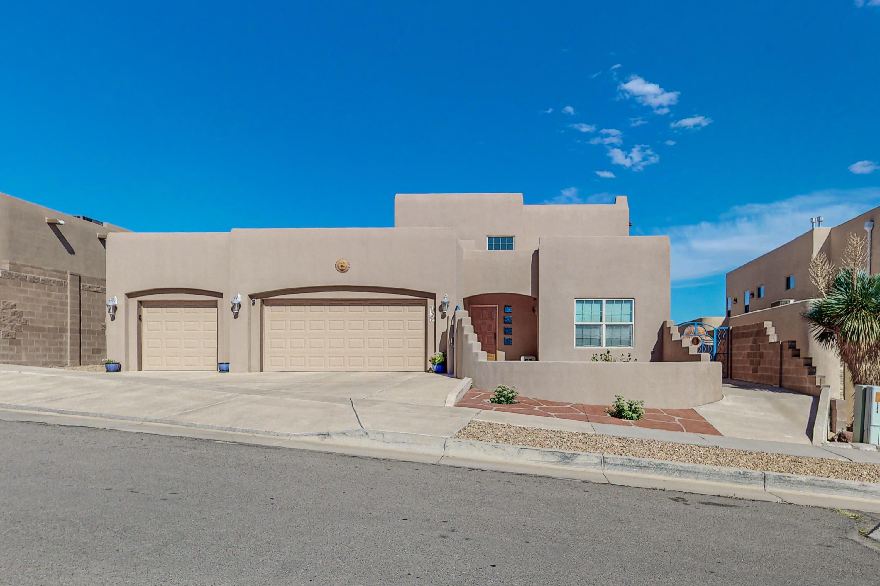 Come and see this fully custom home that was built and designed by Frank Sanchez. This New Mexican home is immaculately cared for and has small details you won't find elsewhere. The wood beams, radiant heated tile flooring, and gas fireplaces really set it apart. Featuring 2 bedrooms, 2 full baths, and 2 living rooms all on the main floor for your ease and comfort. Upstairs is just as lovely with another bedroom, full bathroom, office space, and a balcony with views. The location of this home is ideal for all your needs. Close to shopping, parks, dining and much, much more.