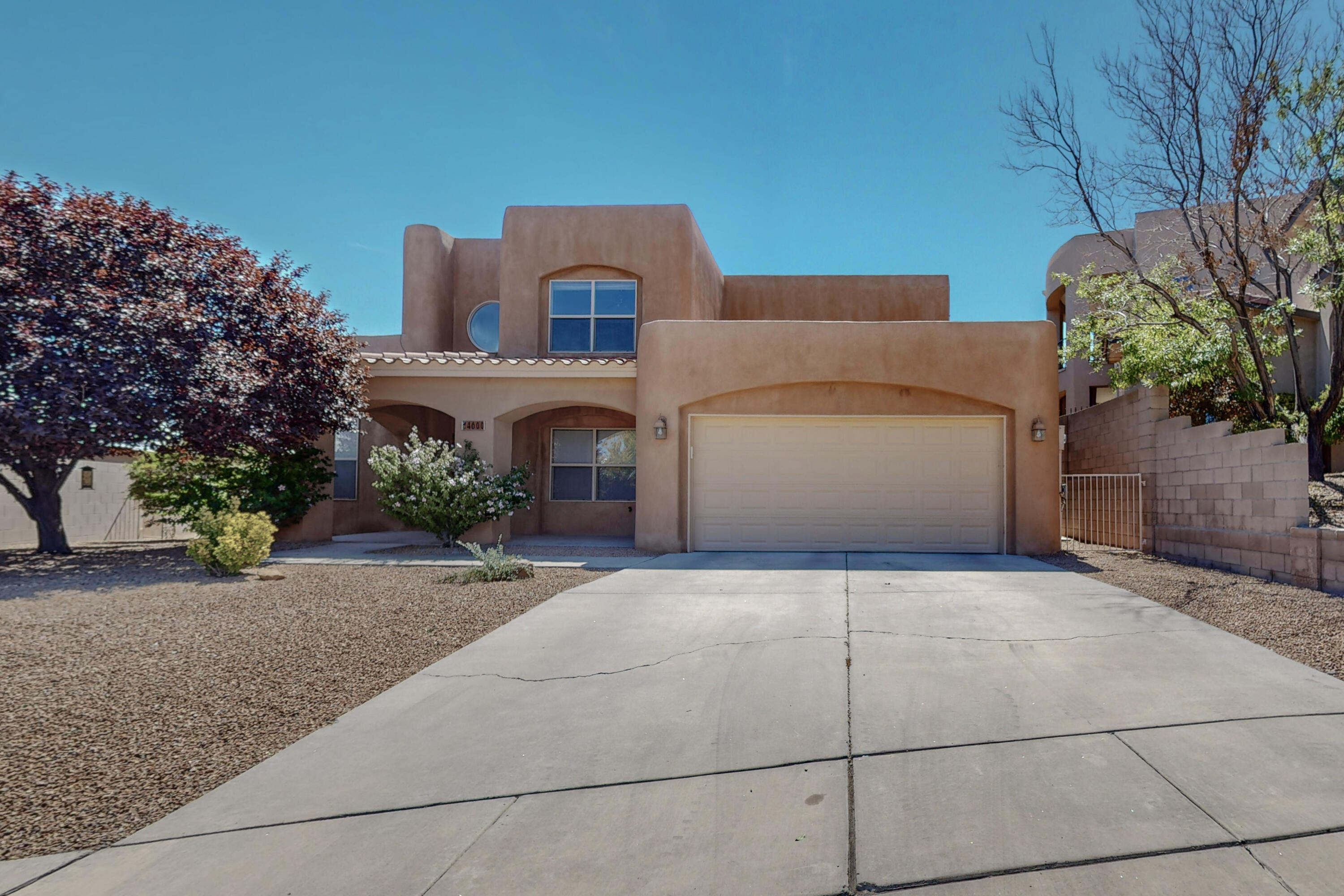 This is truly a beautiful custom home!  Enjoy the natural light from the expanse of windows in the great room, which is open to the dinning area and kitchen.  Kitchen features custom cabinets, granite counter tops, breakfast nook & stainless appliances. Lovely built in desk with additional cabinets will prove to be quite useful!  Primary bedroom on the 1st level is spacious, with walk in closet, double sinks, separate shower and good sized jetted tub!  Upstairs you have 2 bedrooms a full bath and a wonderful loft area that includes nice Balcony as well.  A  service room for your washer and dryer plus extra space, this across from a 1/2 bath on the way to the 2 car finished garage!  Easy maintenance landscape on auto bubble and drip system.  Covered patio for you to relax and enjoy!