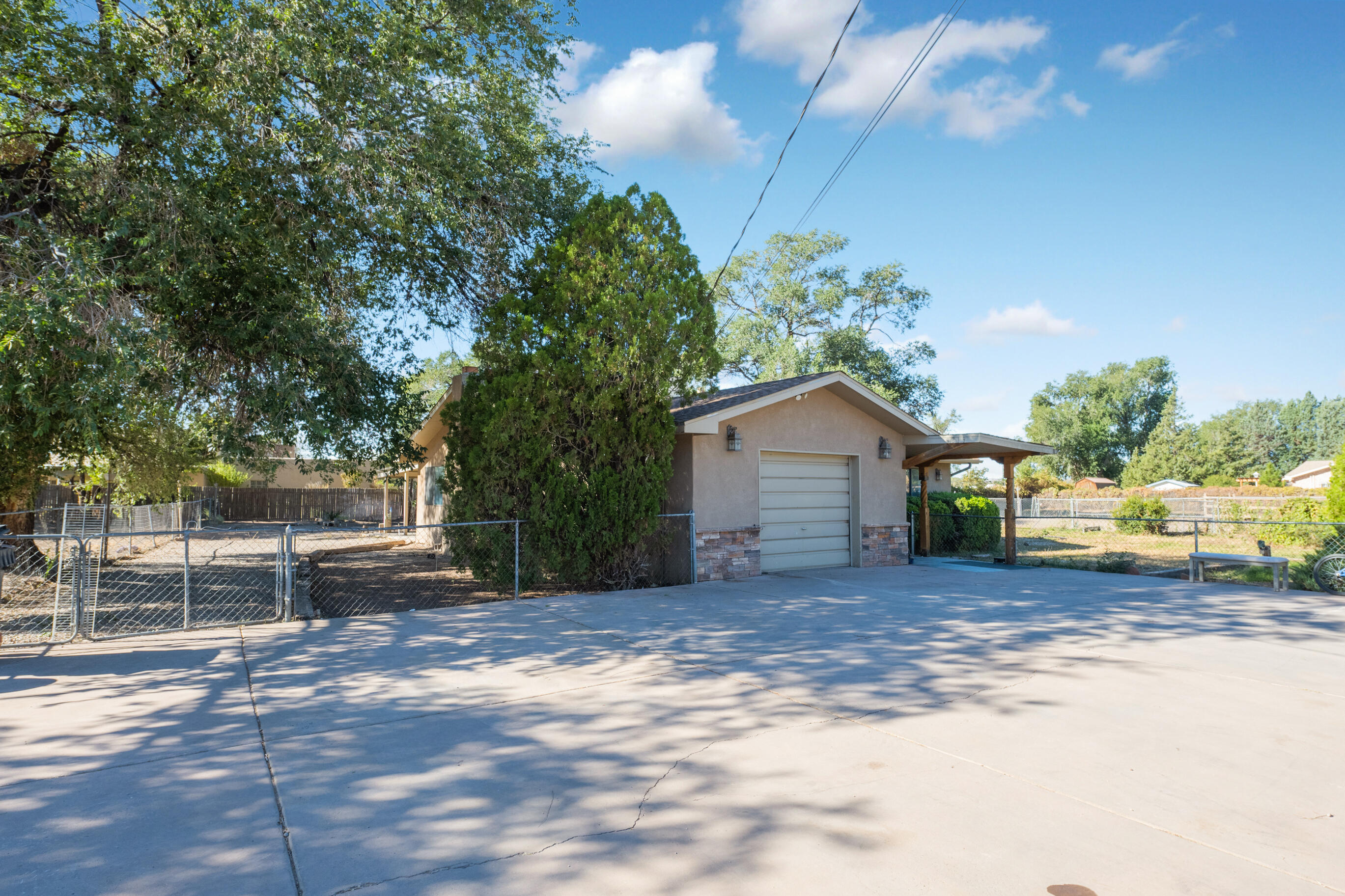 Nestled in the heart of one of Albuquerque's most sought-after neighborhoods, this charming 3-bedroom, 2-bathroom home offers an incredible investment opportunity.  This property is a prime investment opportunity with its acre of land, irrigation rights, proximity to Balloon Fiesta Park, and RV access. You can explore various income-generating possibilities, such as turning it into a vacation rental, a long-term rental, or even subdividing the land for development. The strong demand for housing in this desirable neighborhood ensures a steady stream of potential tenants or buyers and/or a beautiful place to live for you or a family! Don't miss this exceptional opportunity! Whether you're looking for a place to call home or seeking a lucrative investment venture, this property has it all.